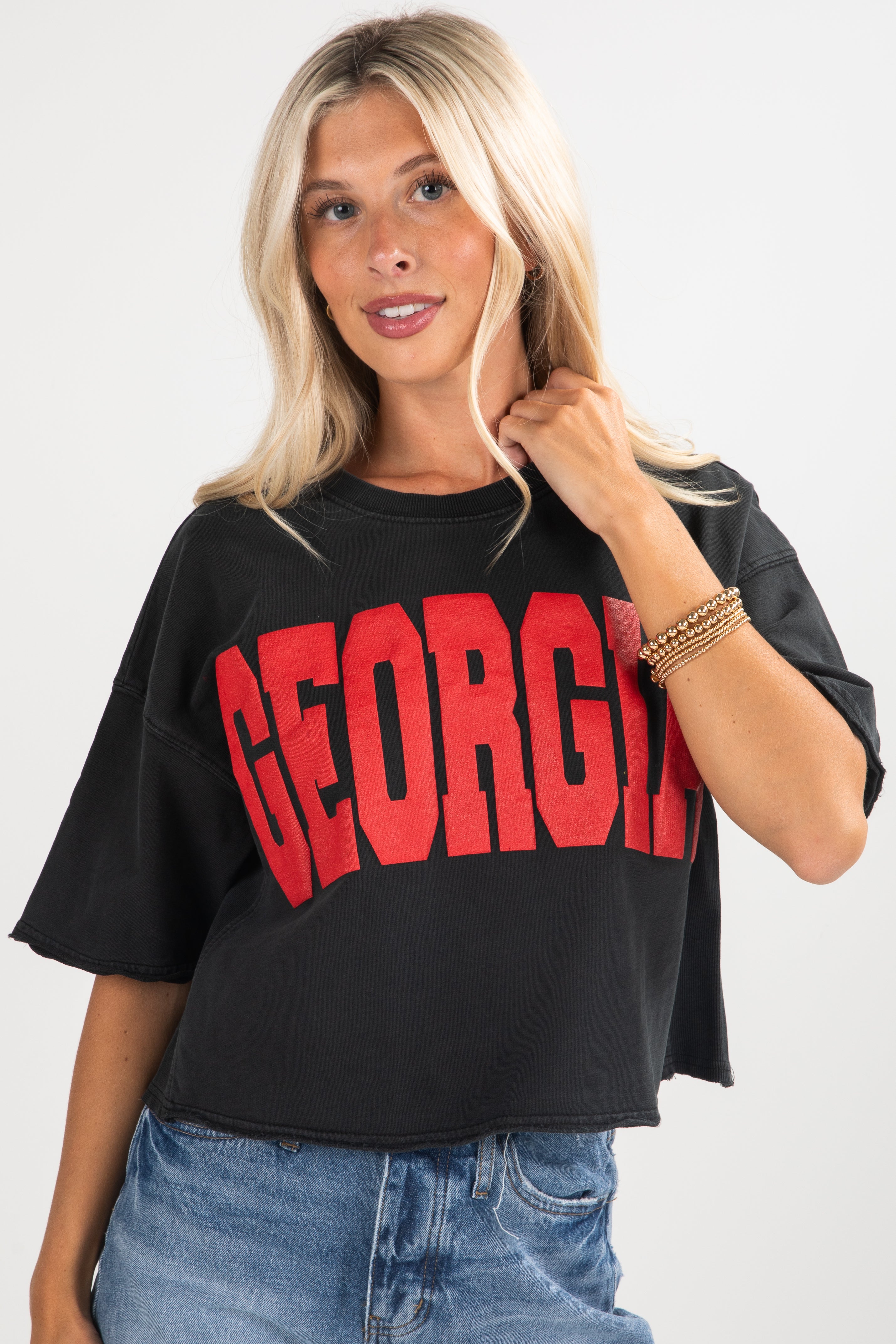 Woman wearing a black t-shirt with &