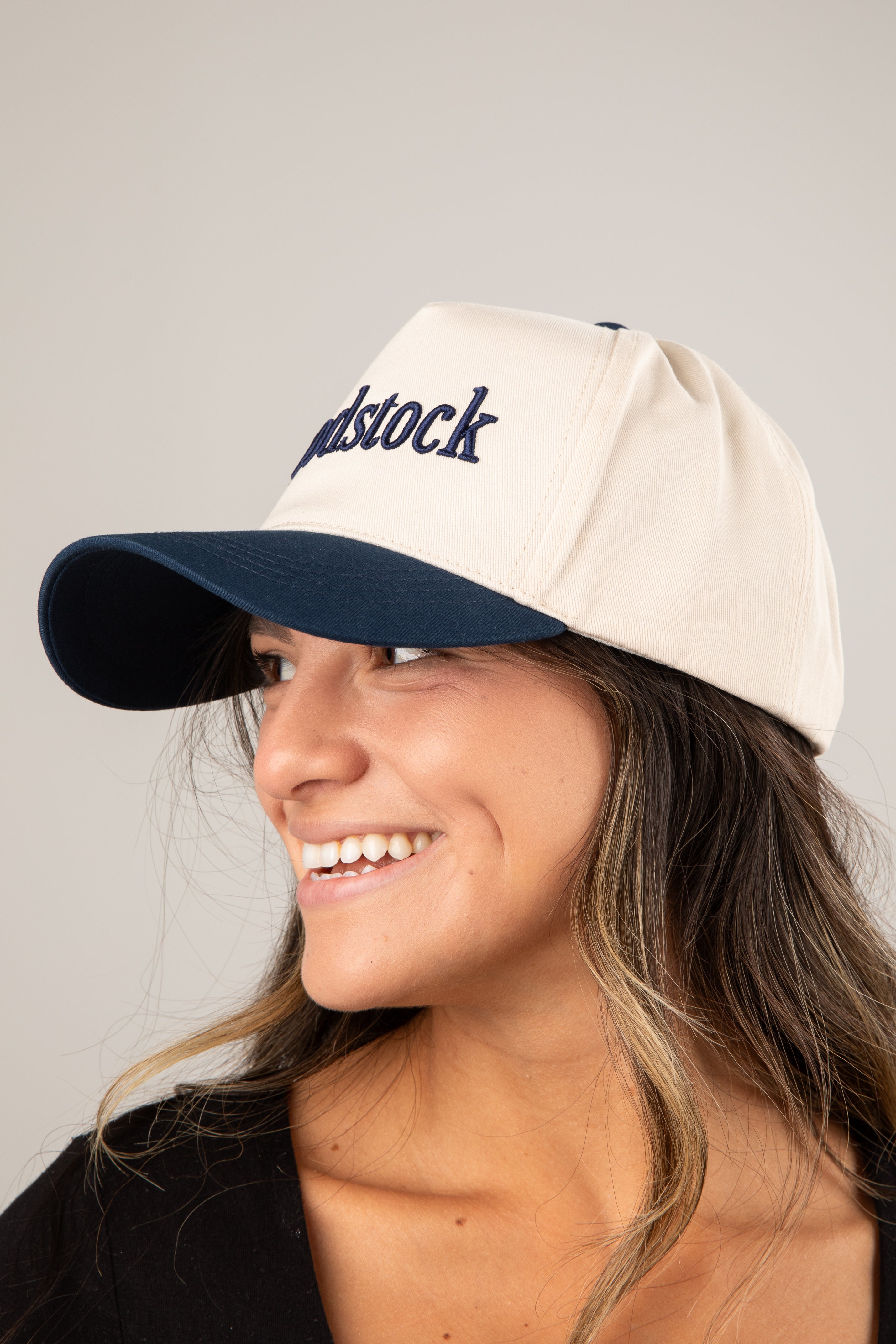 Person wearing a cap with &