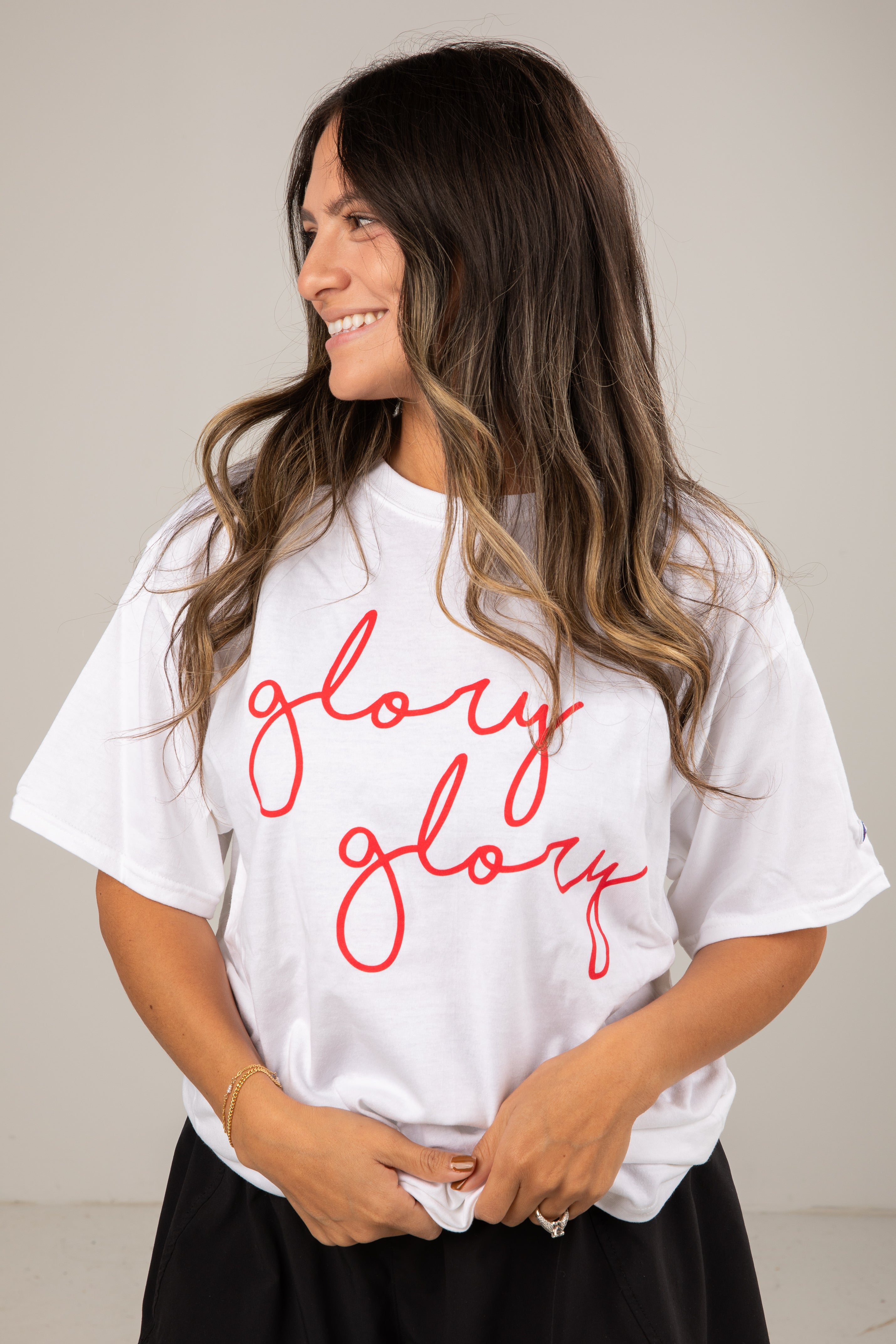 Woman wearing a white t-shirt with &