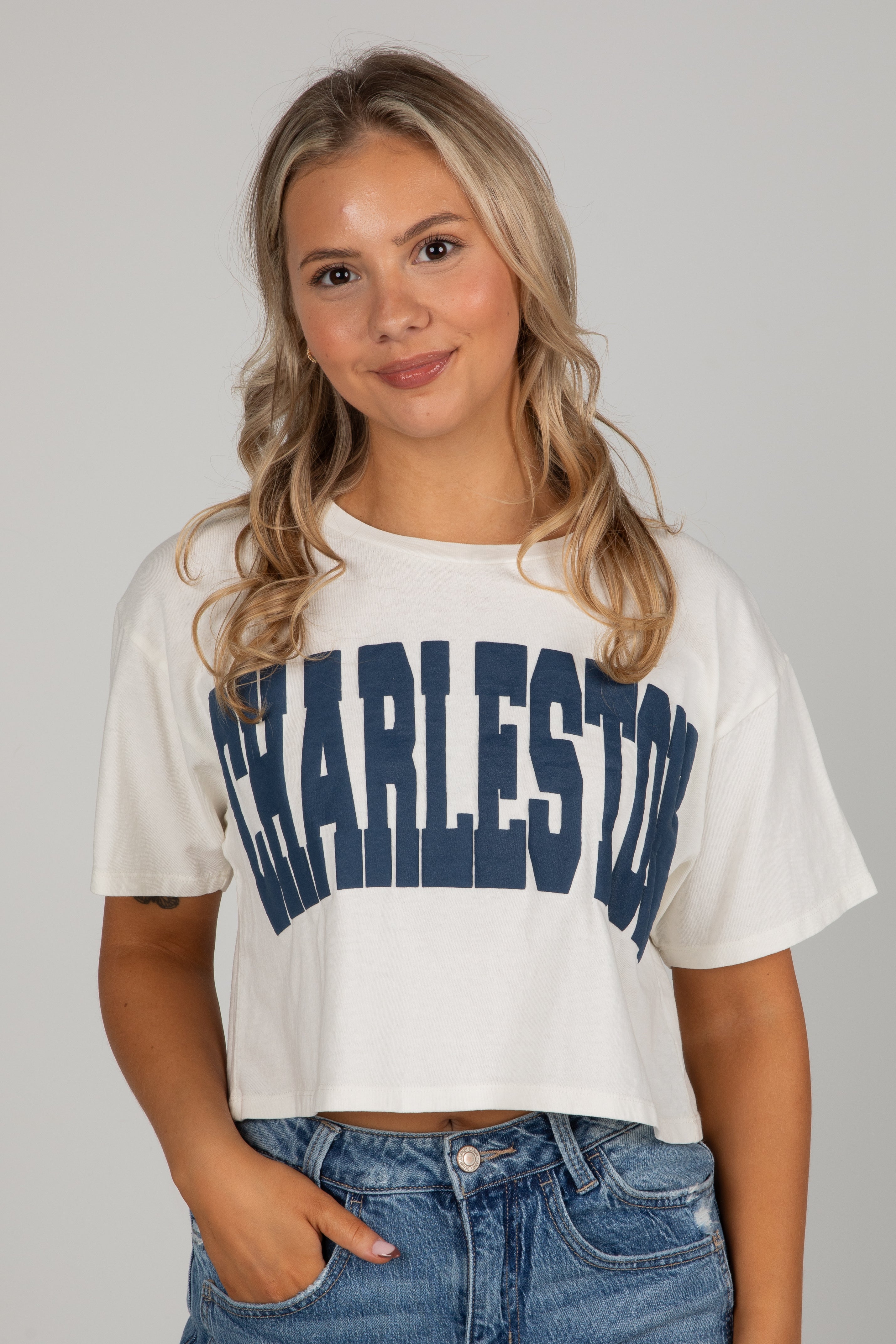 Woman wearing a white t-shirt with &