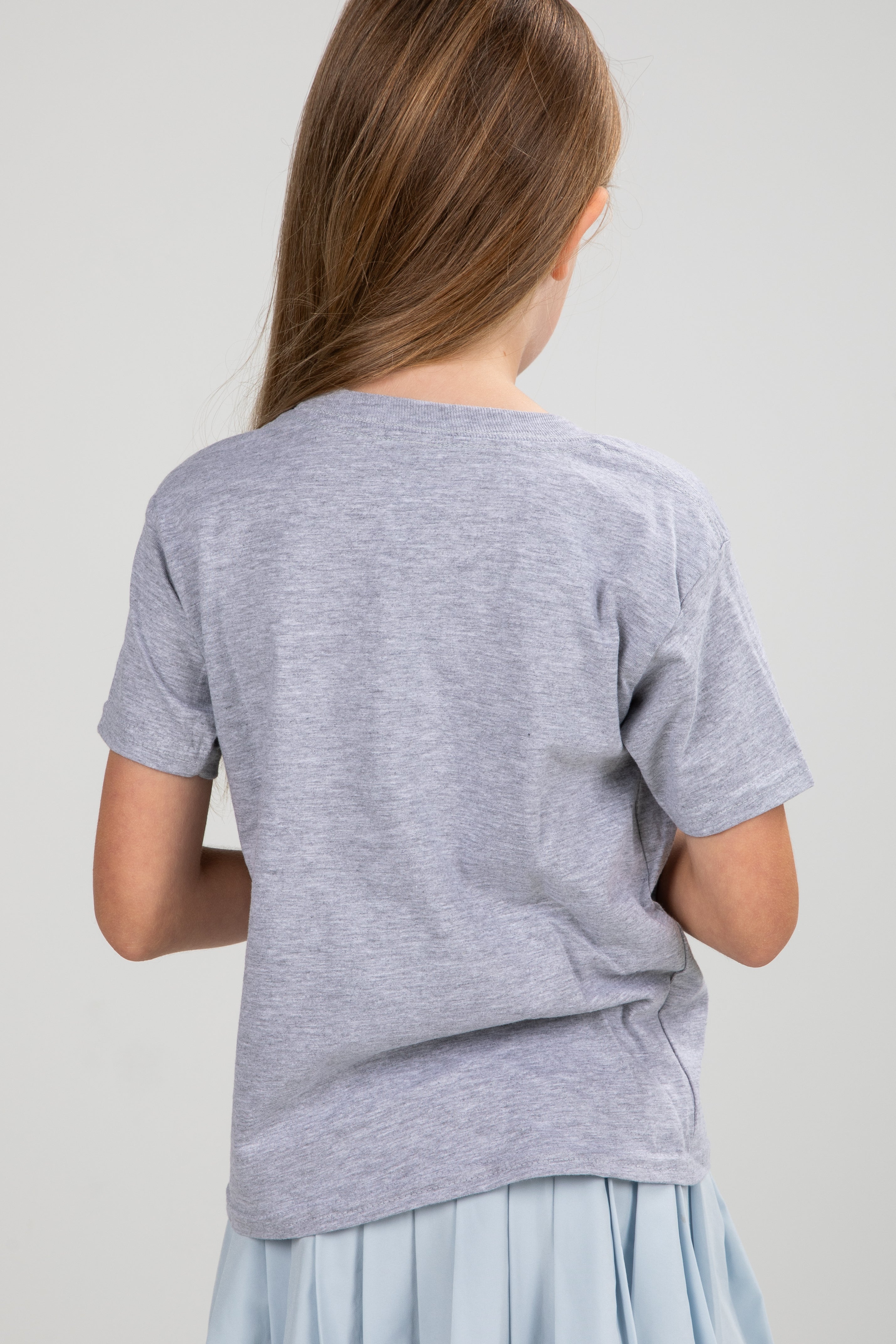 Person wearing a gray t-shirt on a plain background