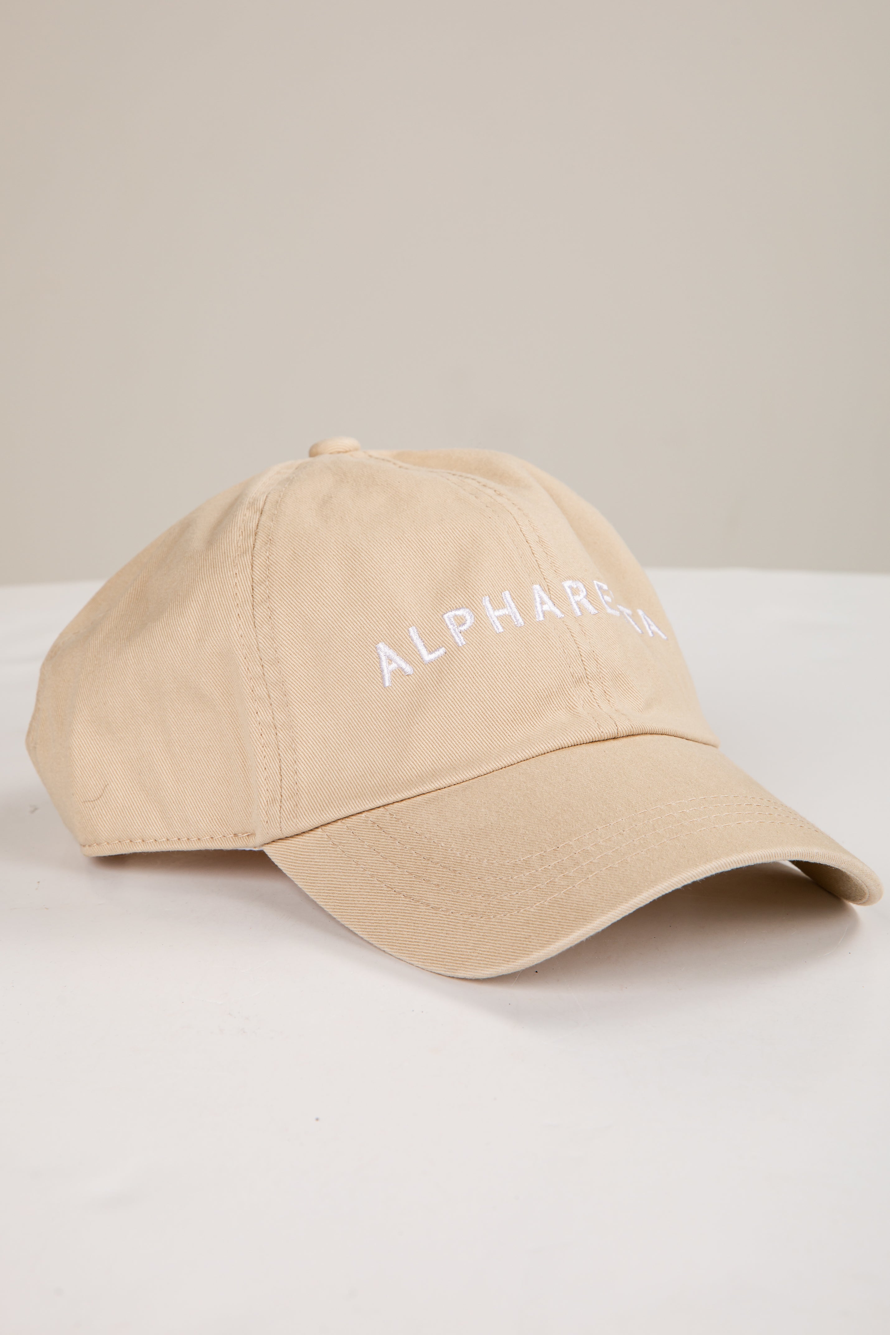 Beige cap with &