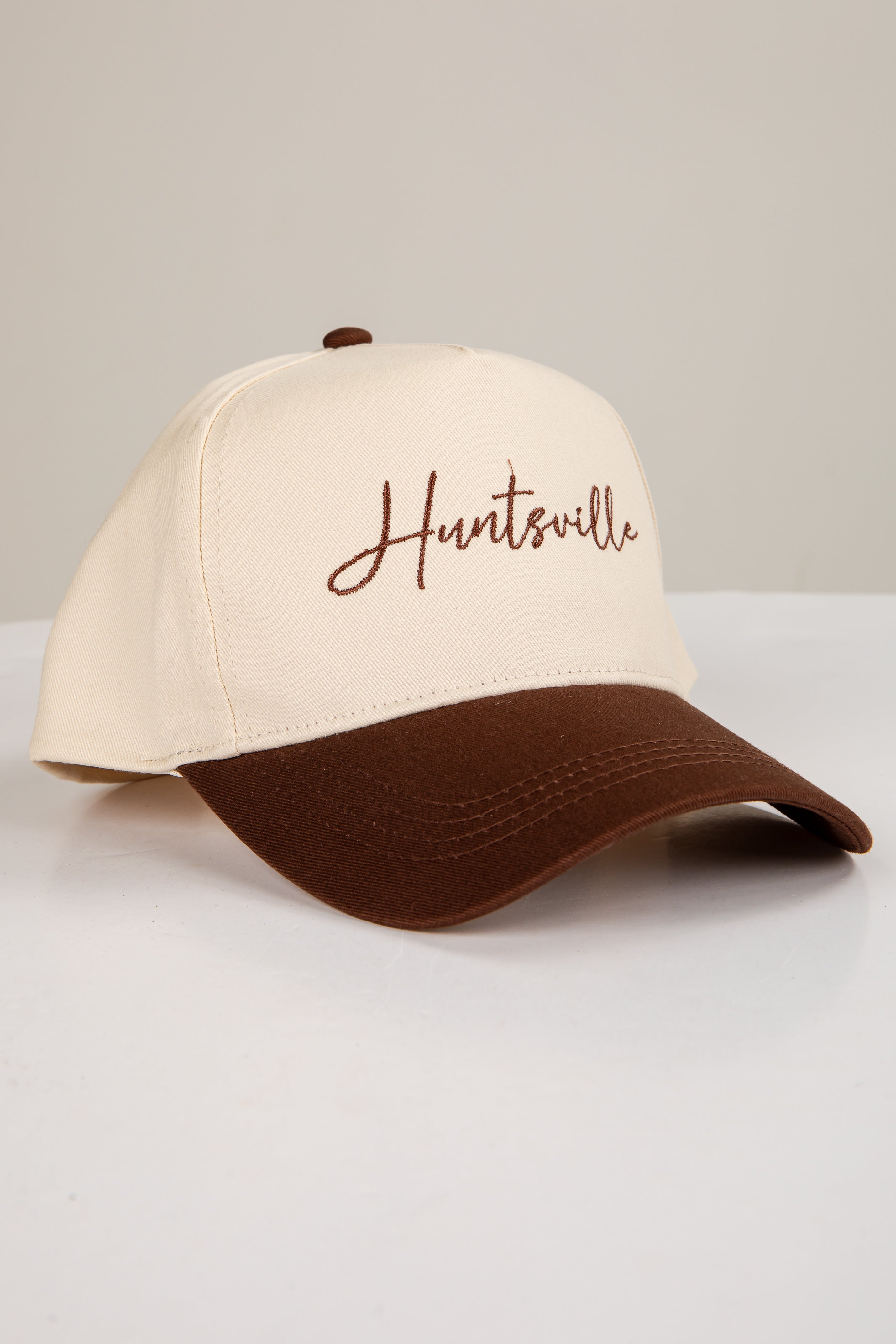 Beige and brown cap with &