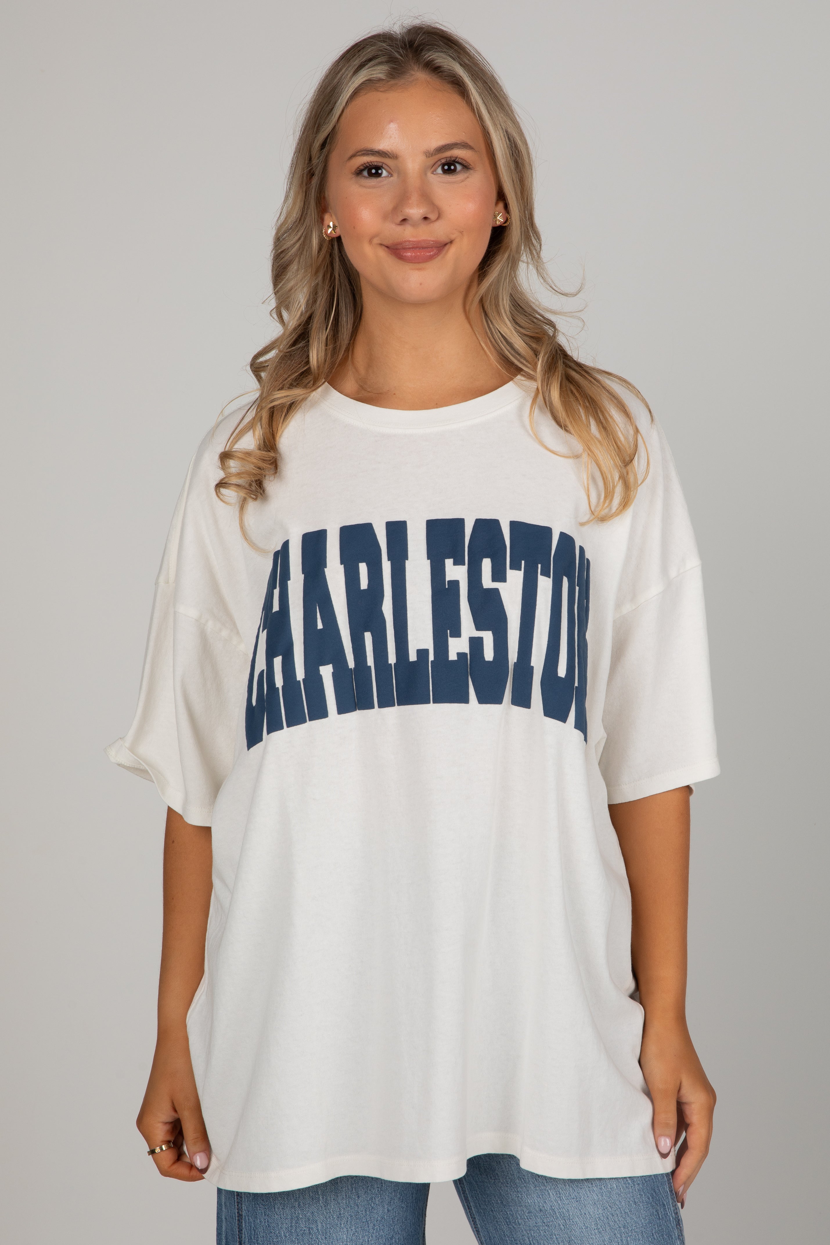 Woman wearing a white t-shirt with &