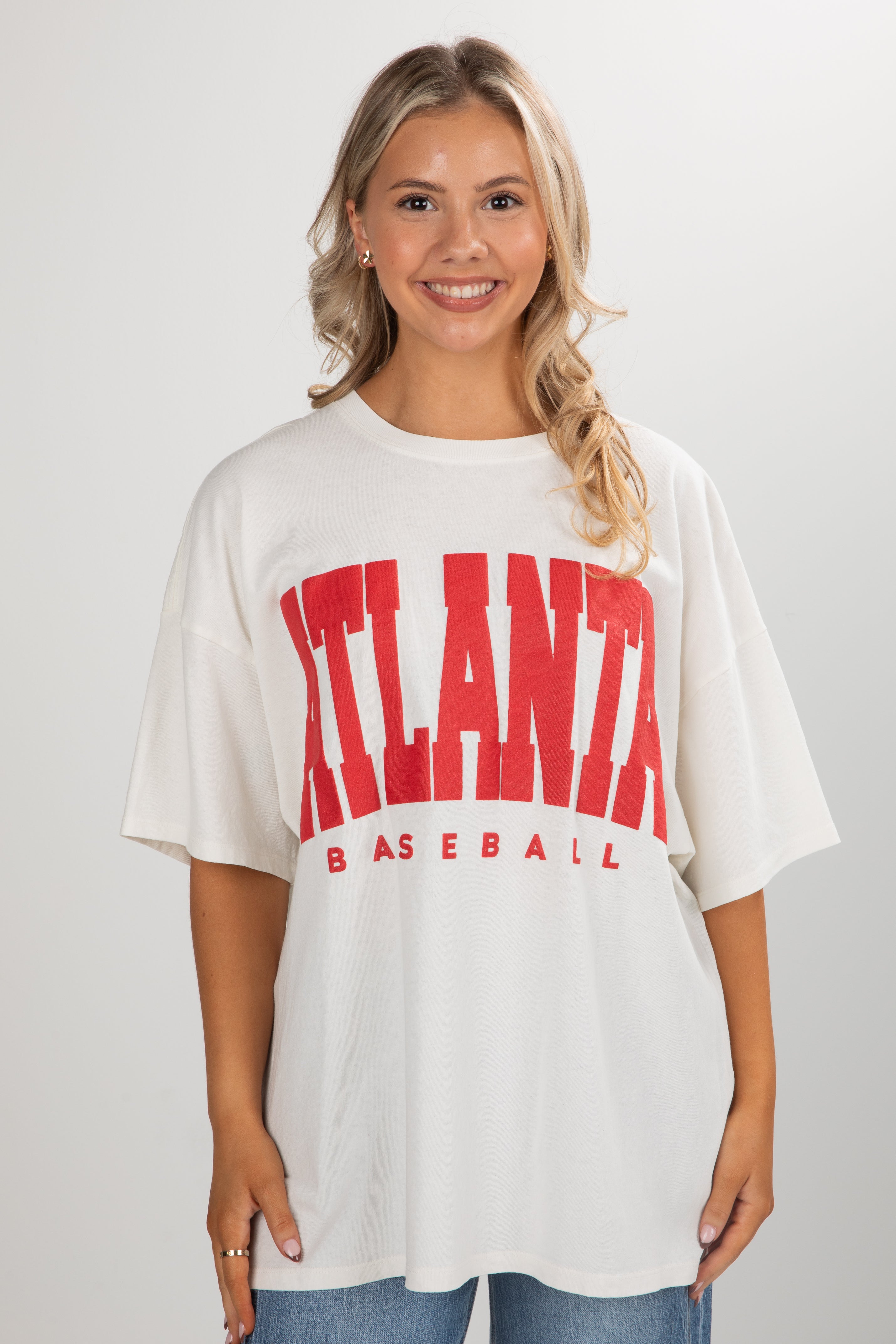 Woman wearing a white t-shirt with &