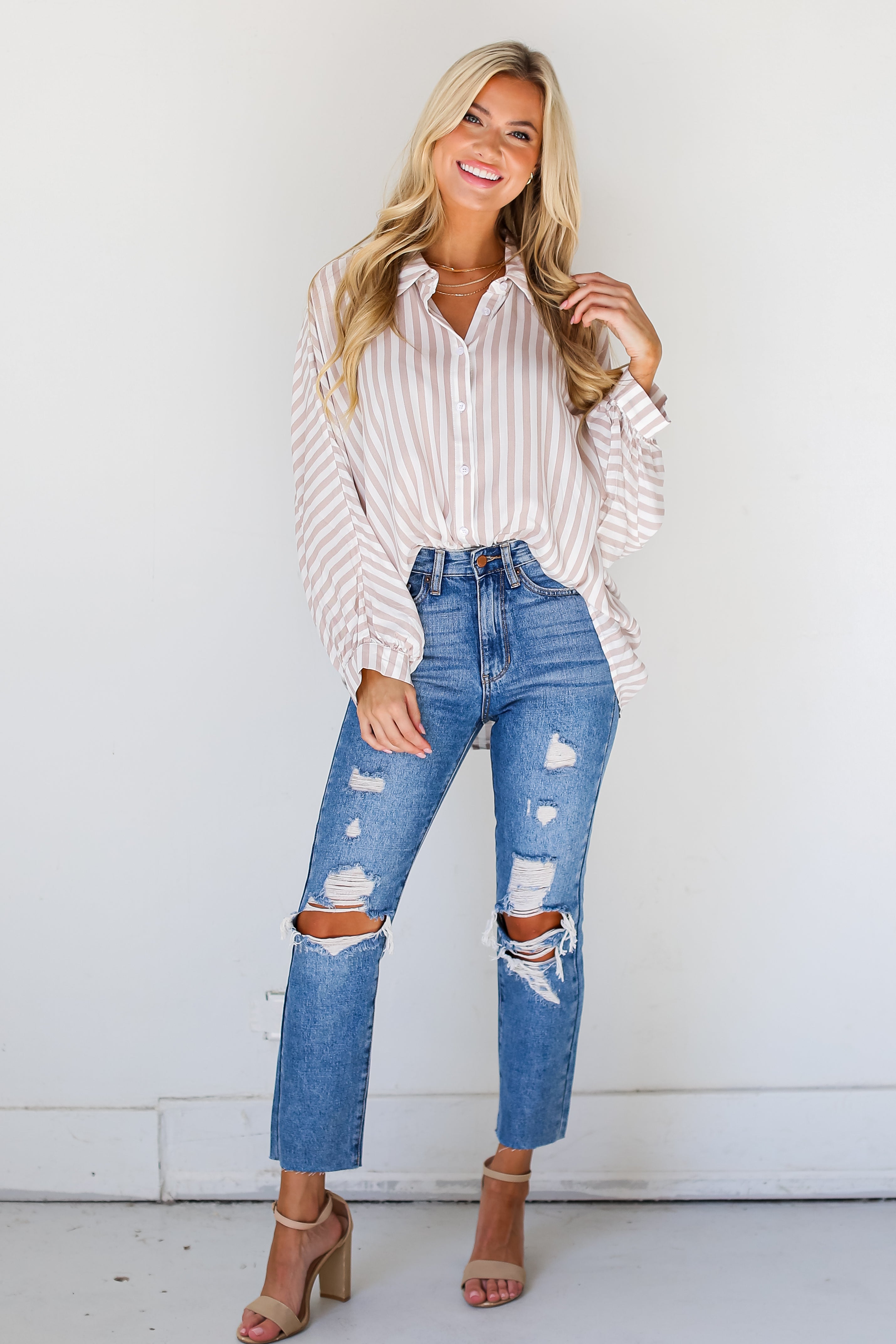 medium wash Distressed Mom Jeans on dress up model