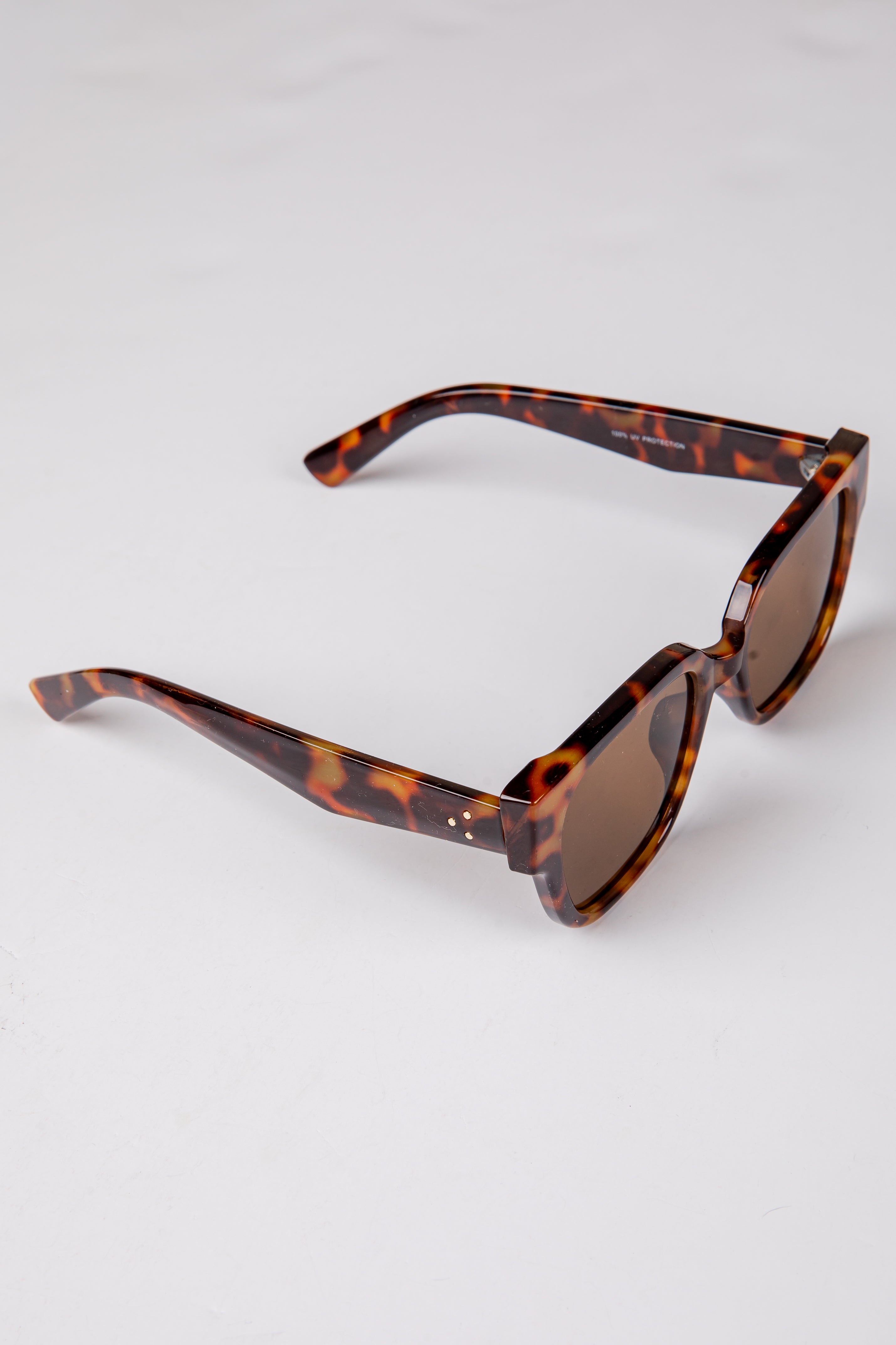 Tortoiseshell sunglasses on a white background