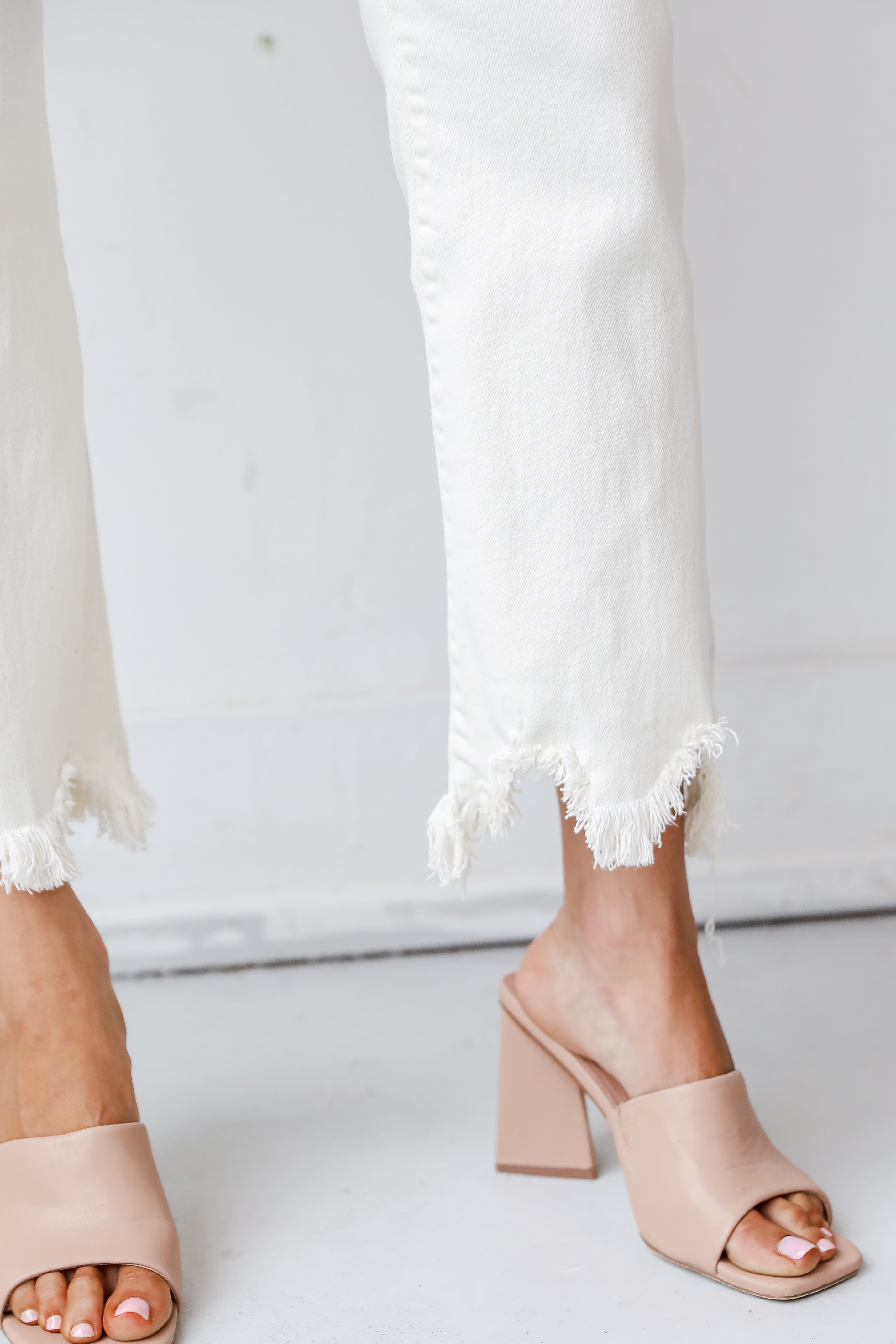 Cream Distressed Cropped Flare Jeans close up