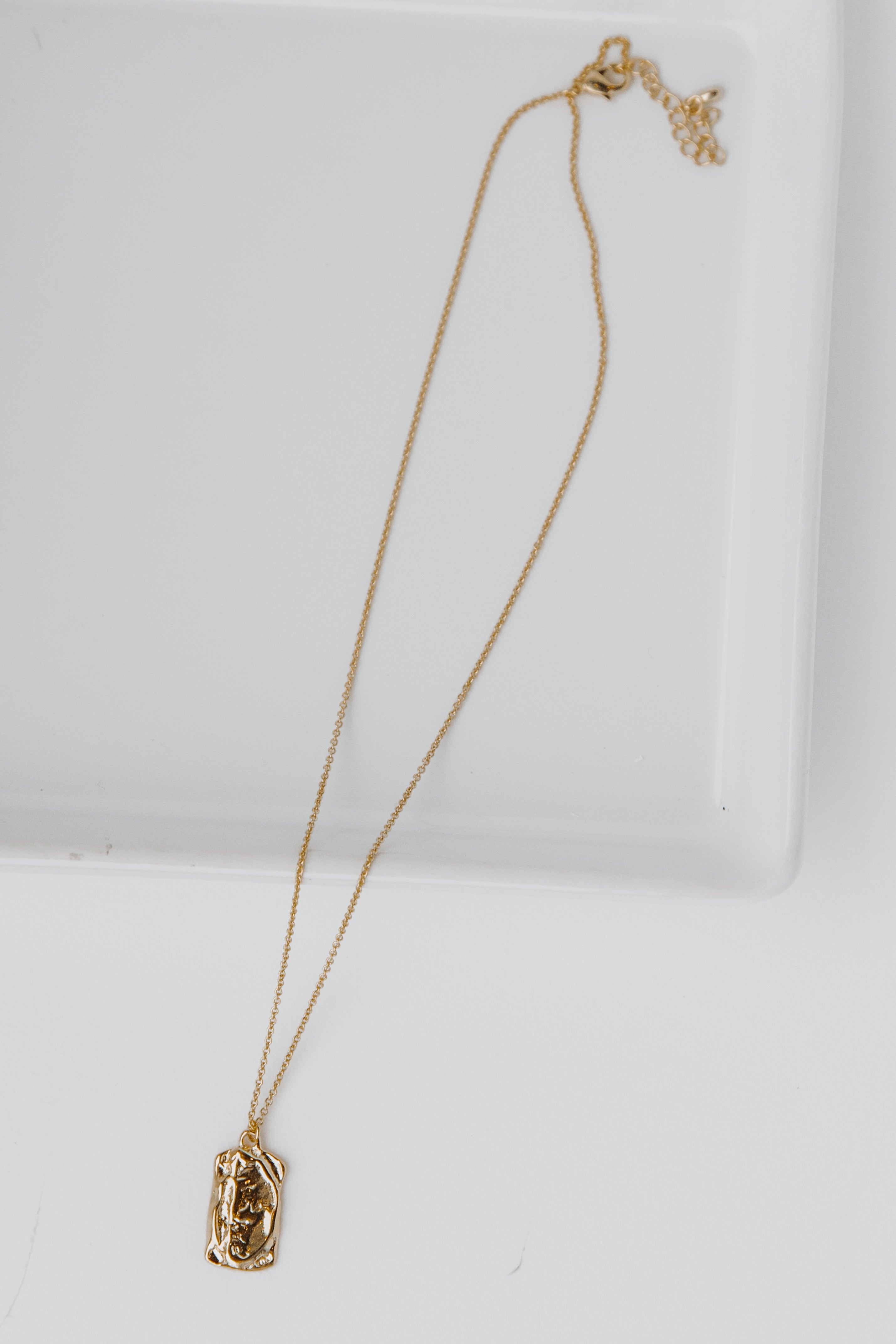 Gold Pendant Necklace flat lay