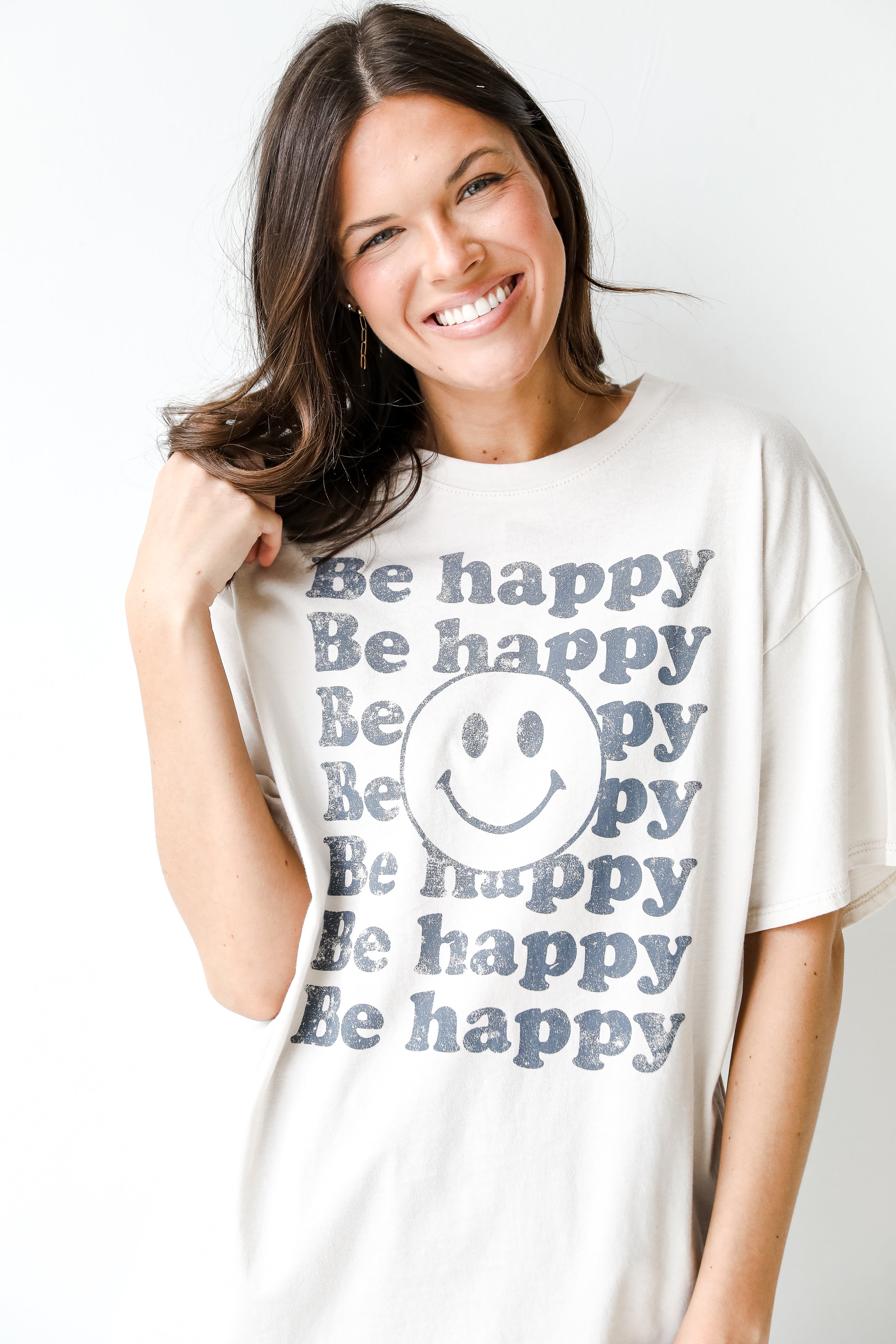 Be Happy Smiley Face Graphic Tee on model