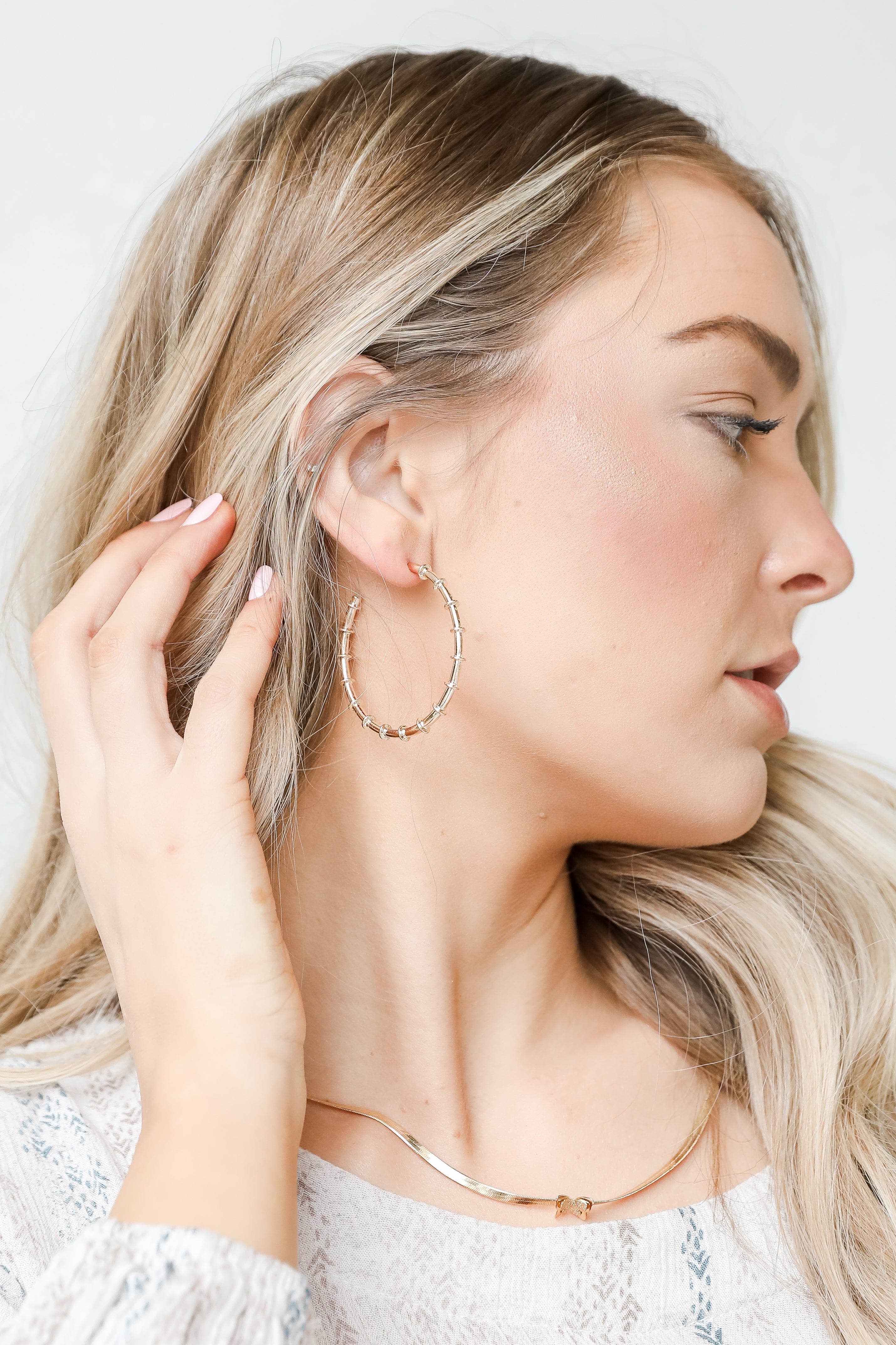 Gold Hoop Earrings on model