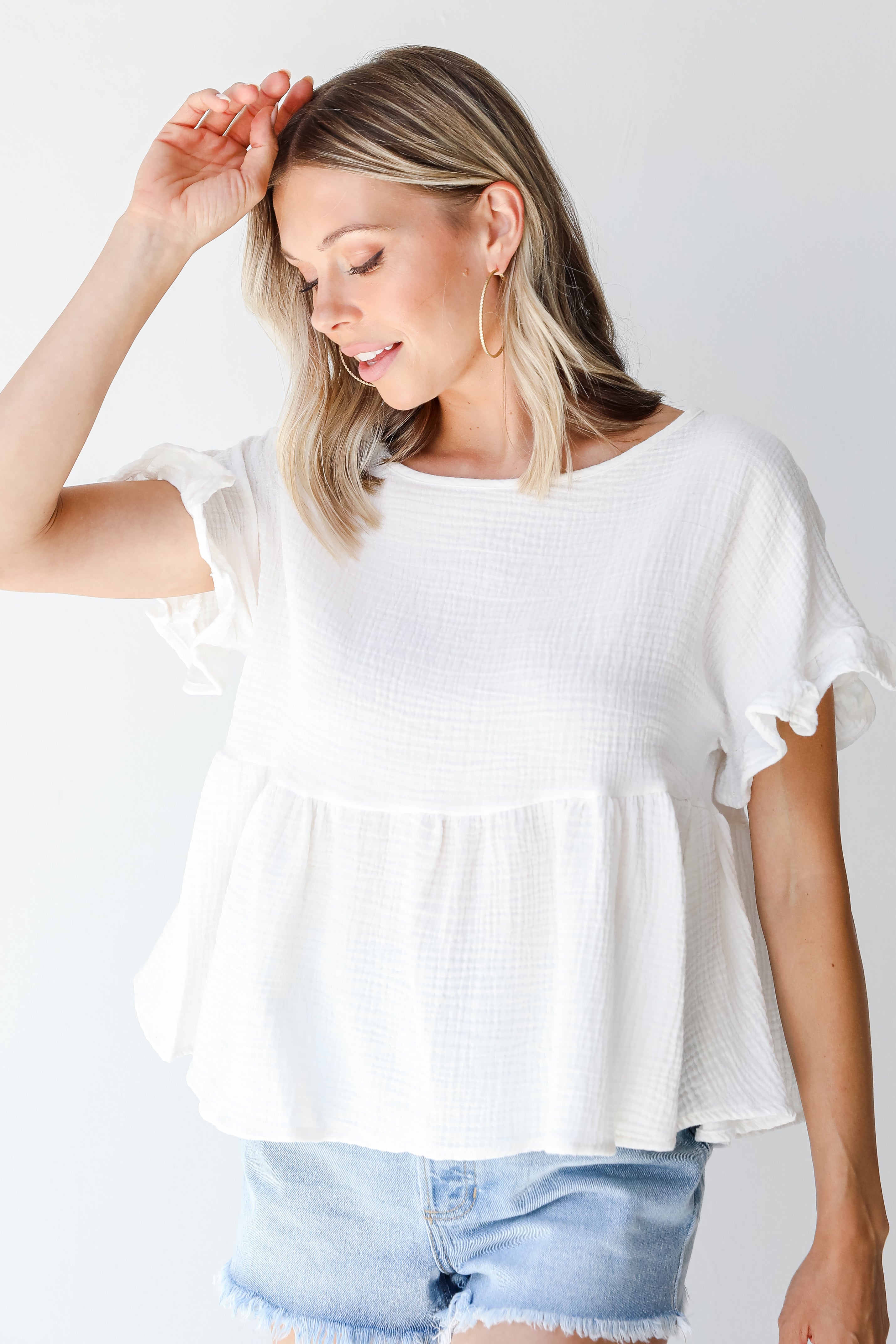 Linen Babydoll Top in white on model