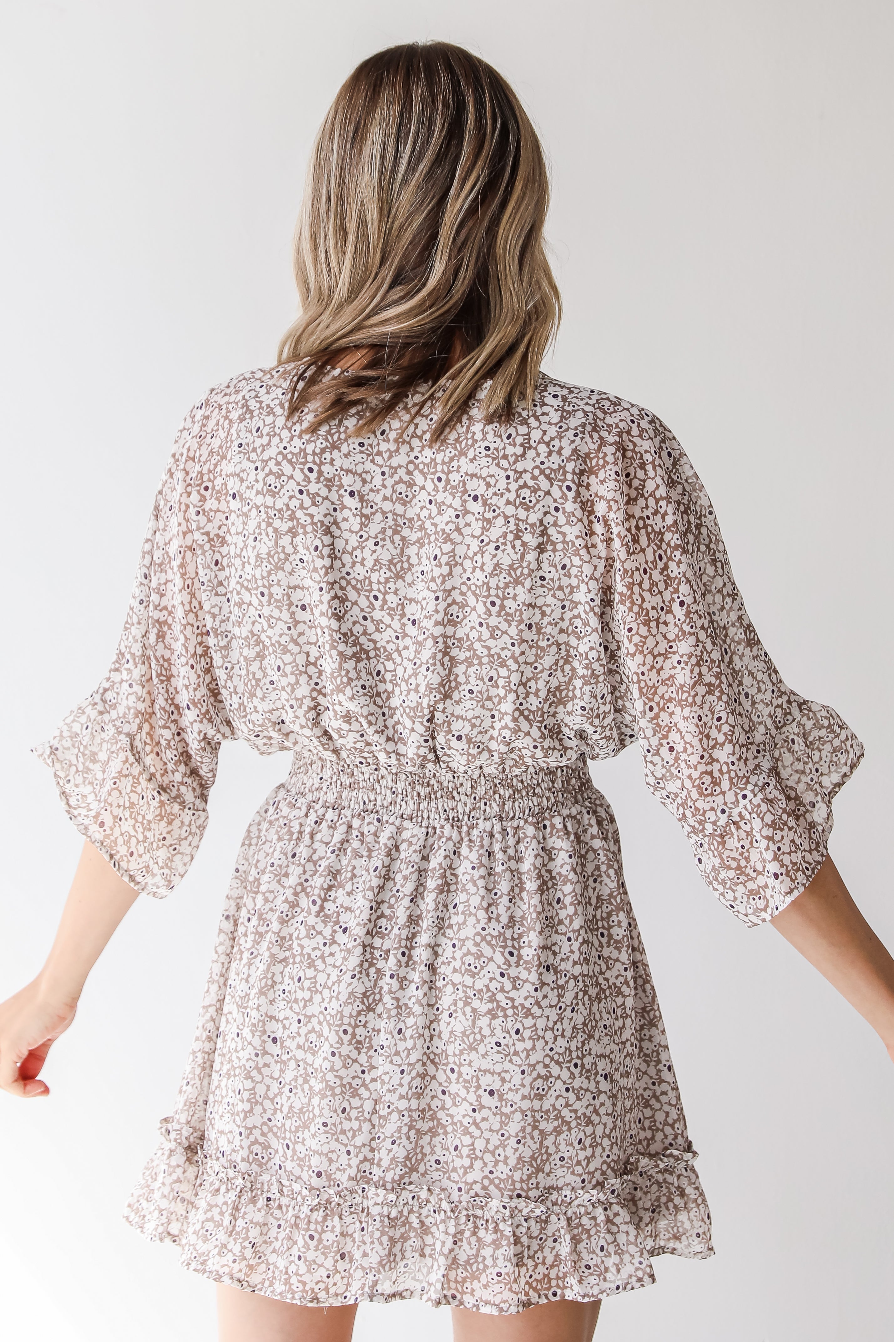 tan floral mini dress back view