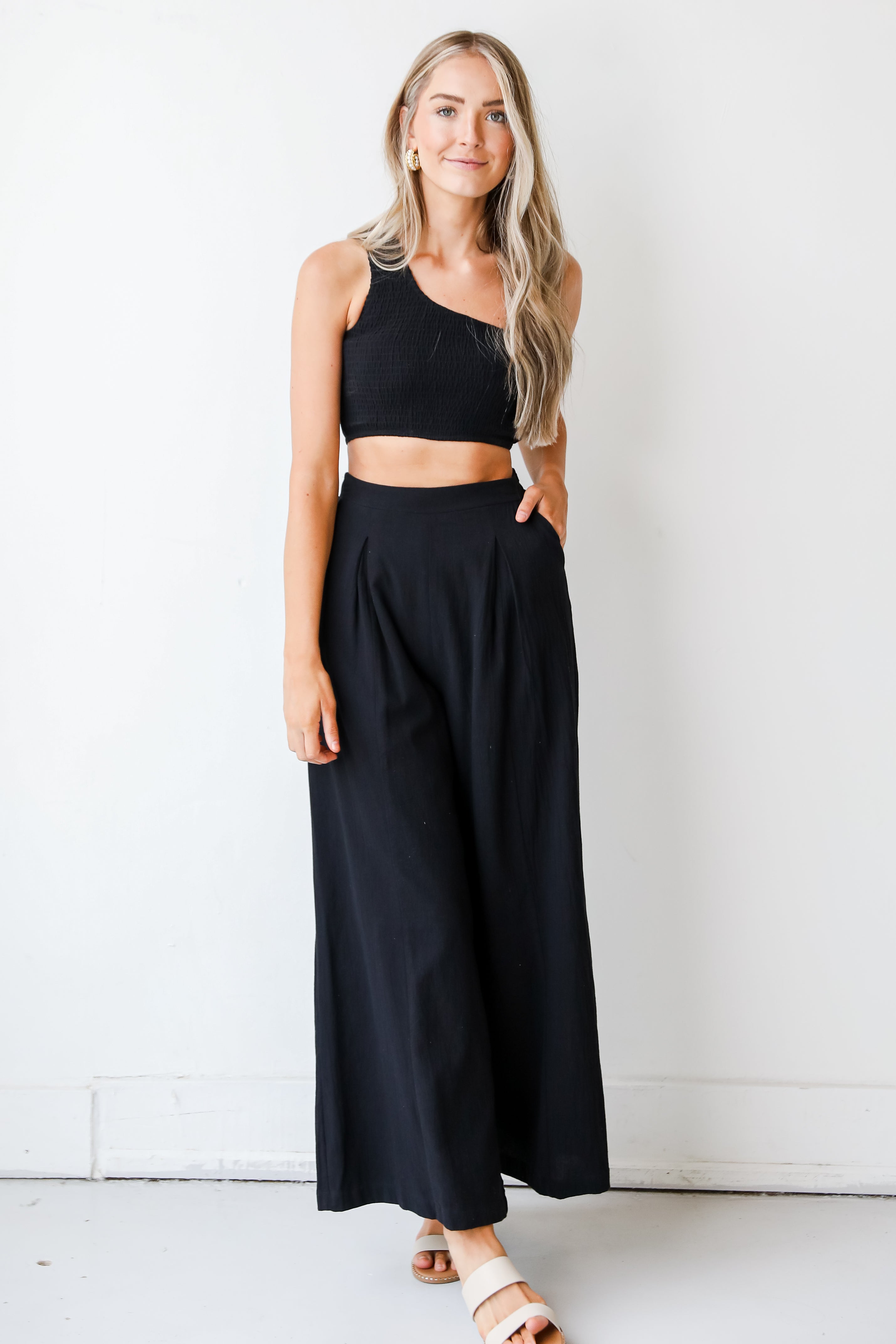 Smocked One-Shoulder Crop Top in black on model