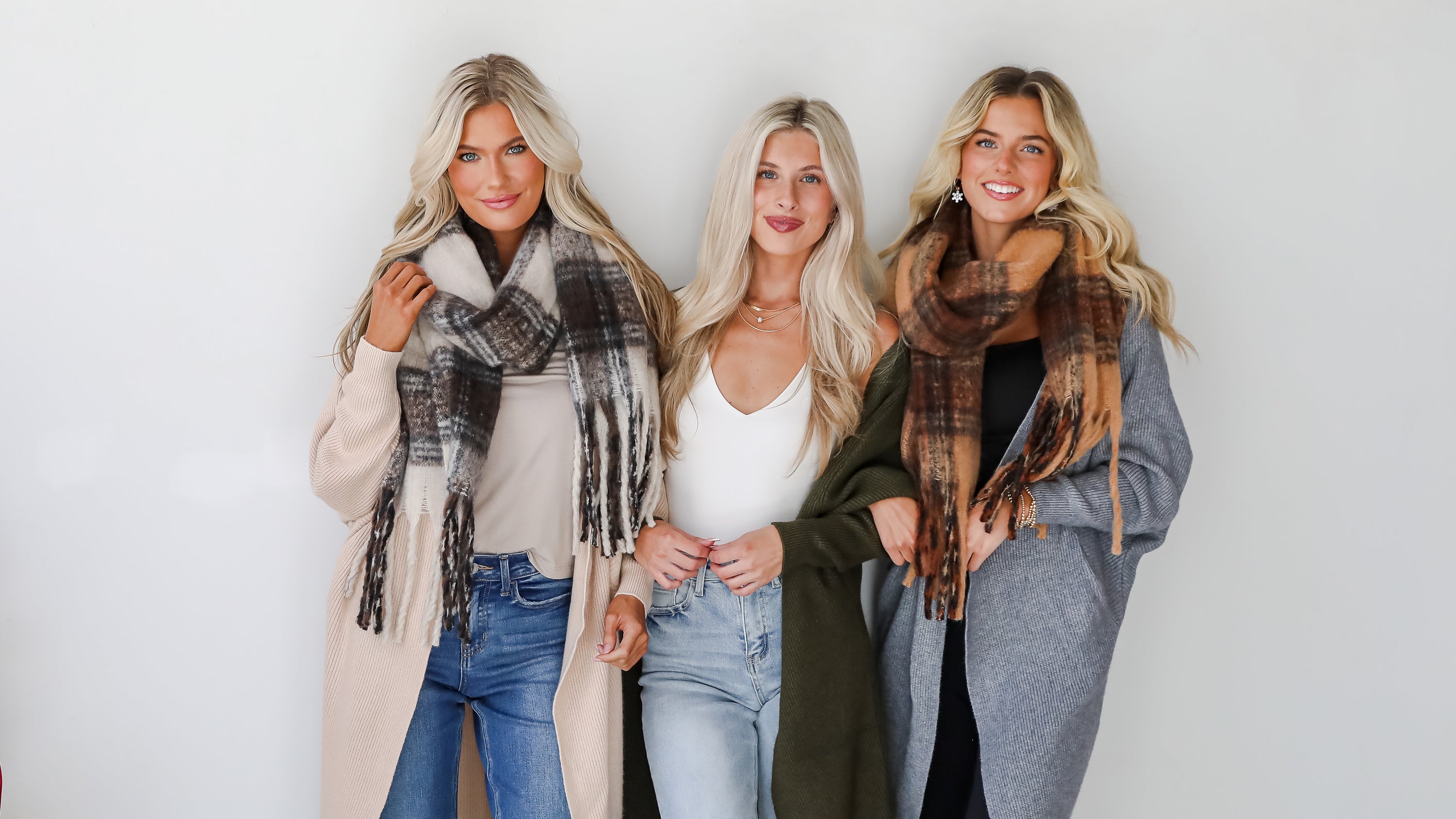 models wearing scarves and winter outfits