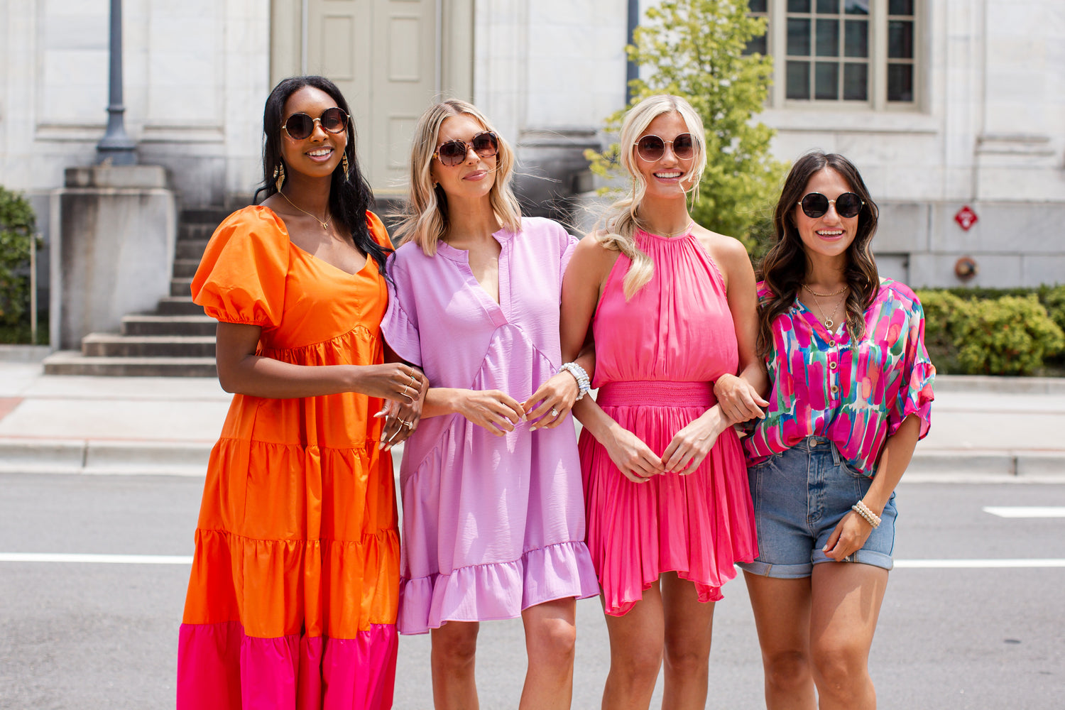 models wearing bright colored outfits