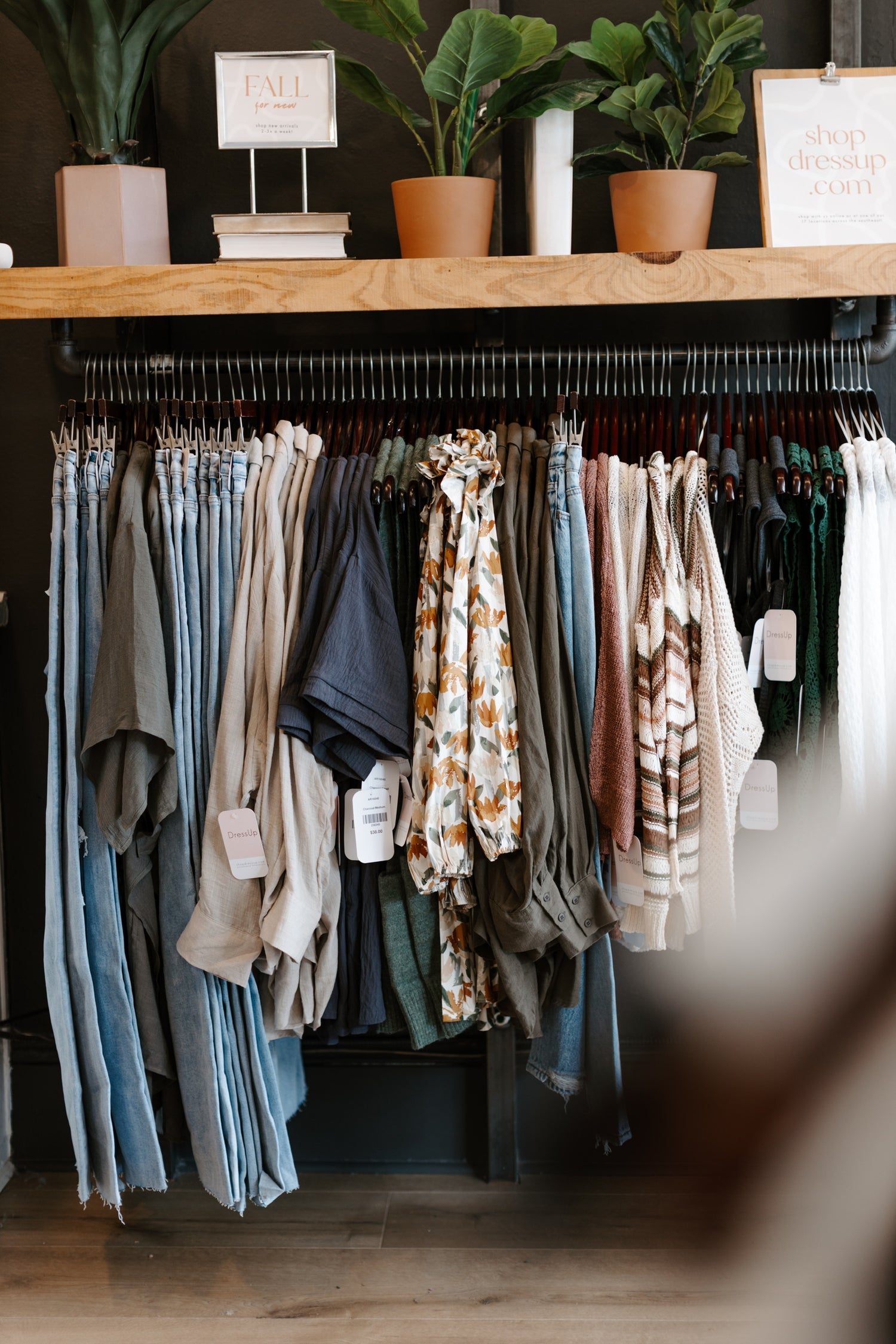 image of fall clothing hanging in a rack in a store