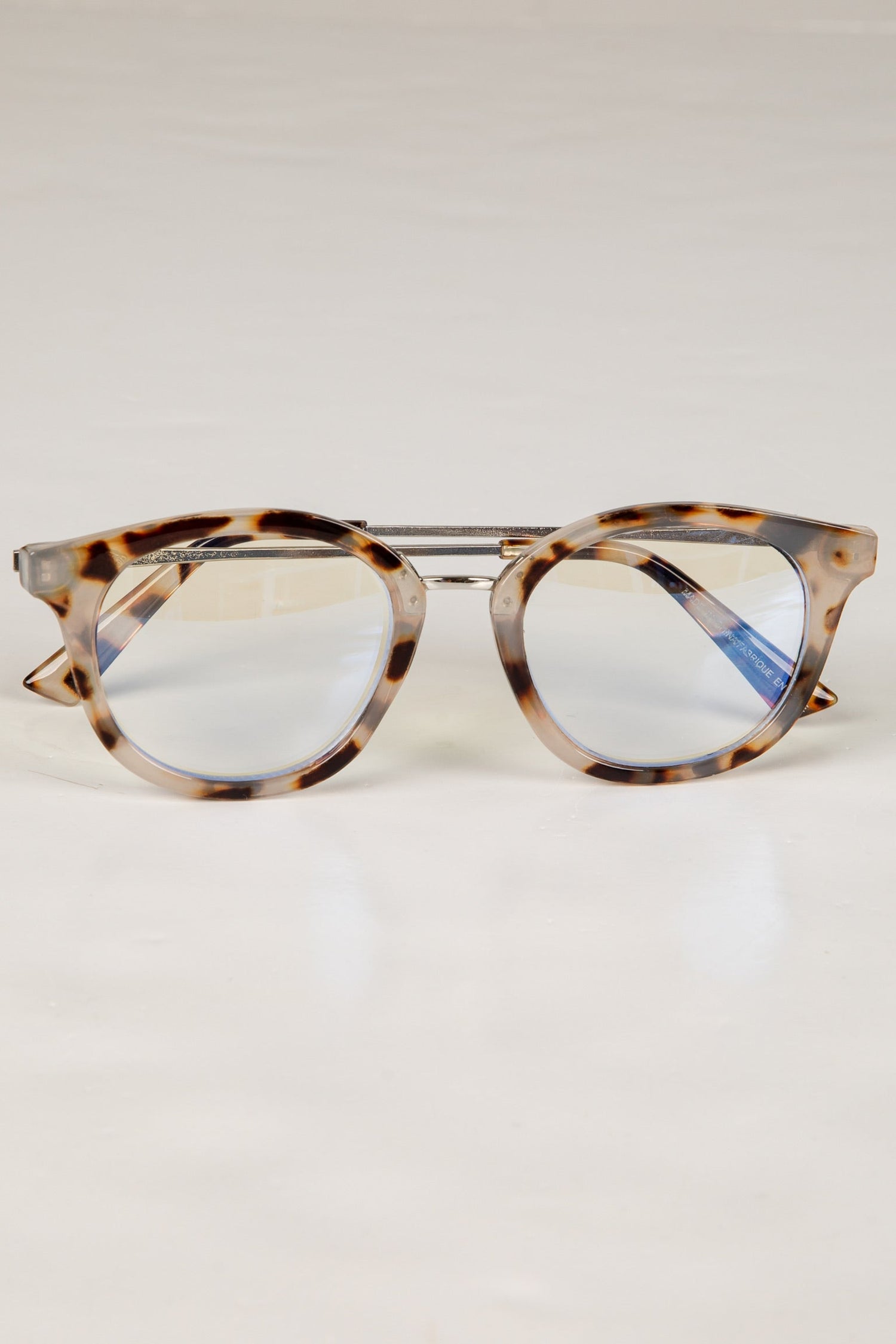 Tortoiseshell cat-eye glasses on a white background