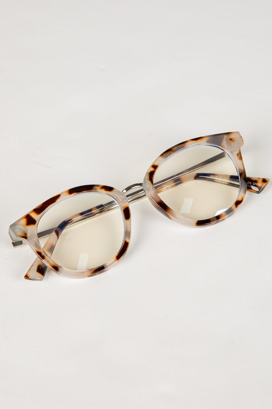 Tortoiseshell sunglasses on a white background