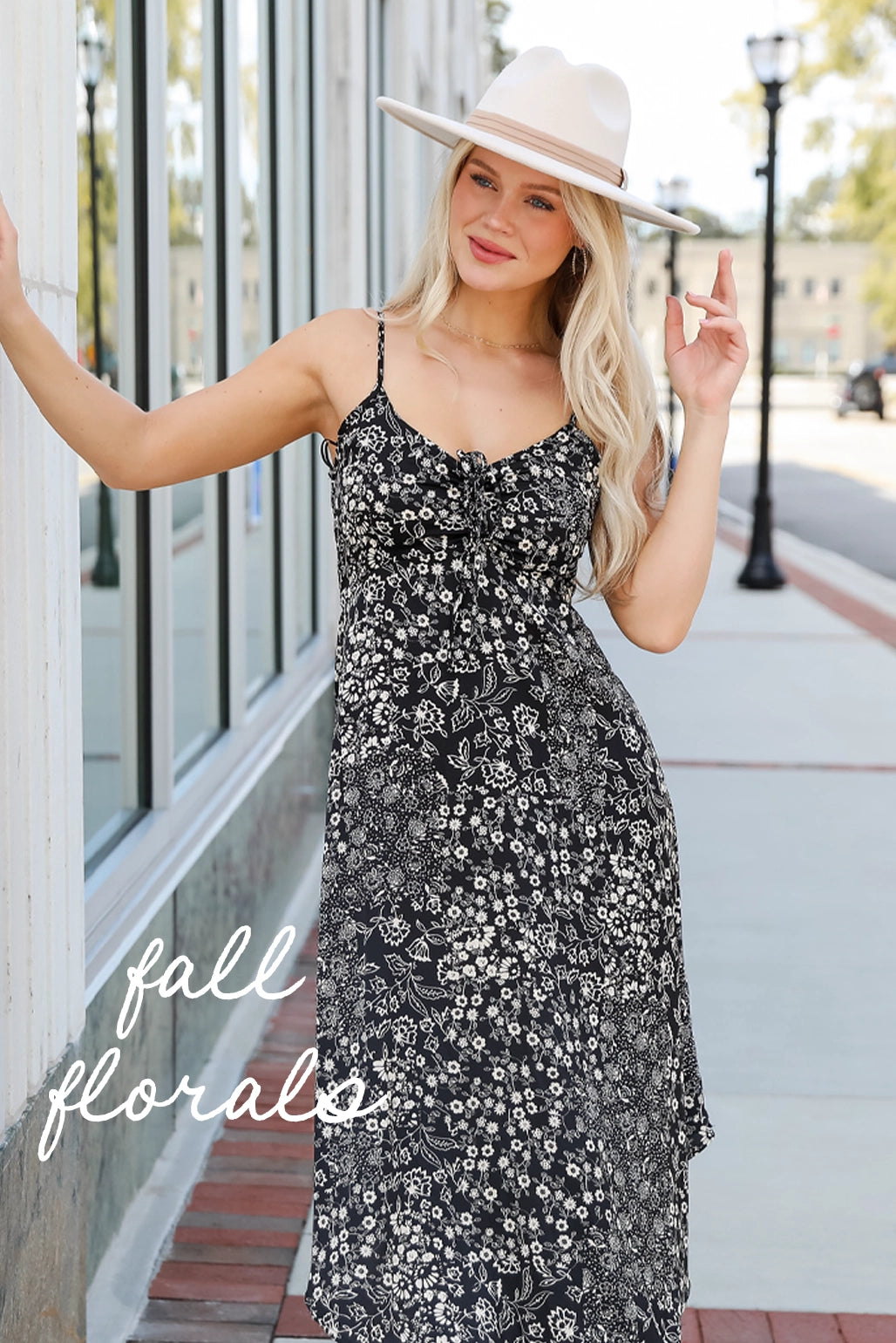 model wearing maxi floral dress in black