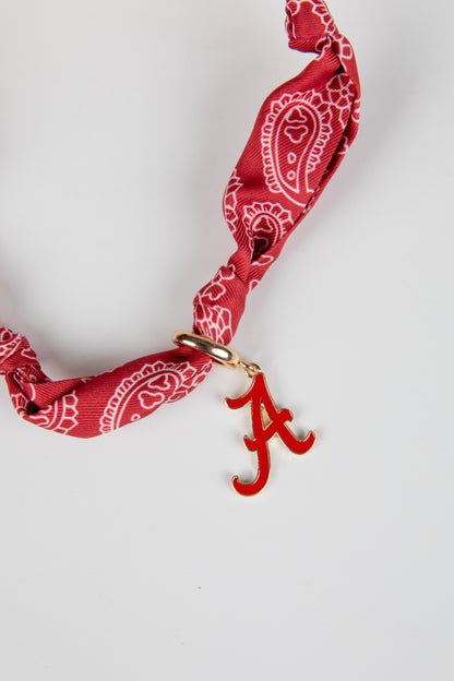 Red bandana with a gold clasp and red &