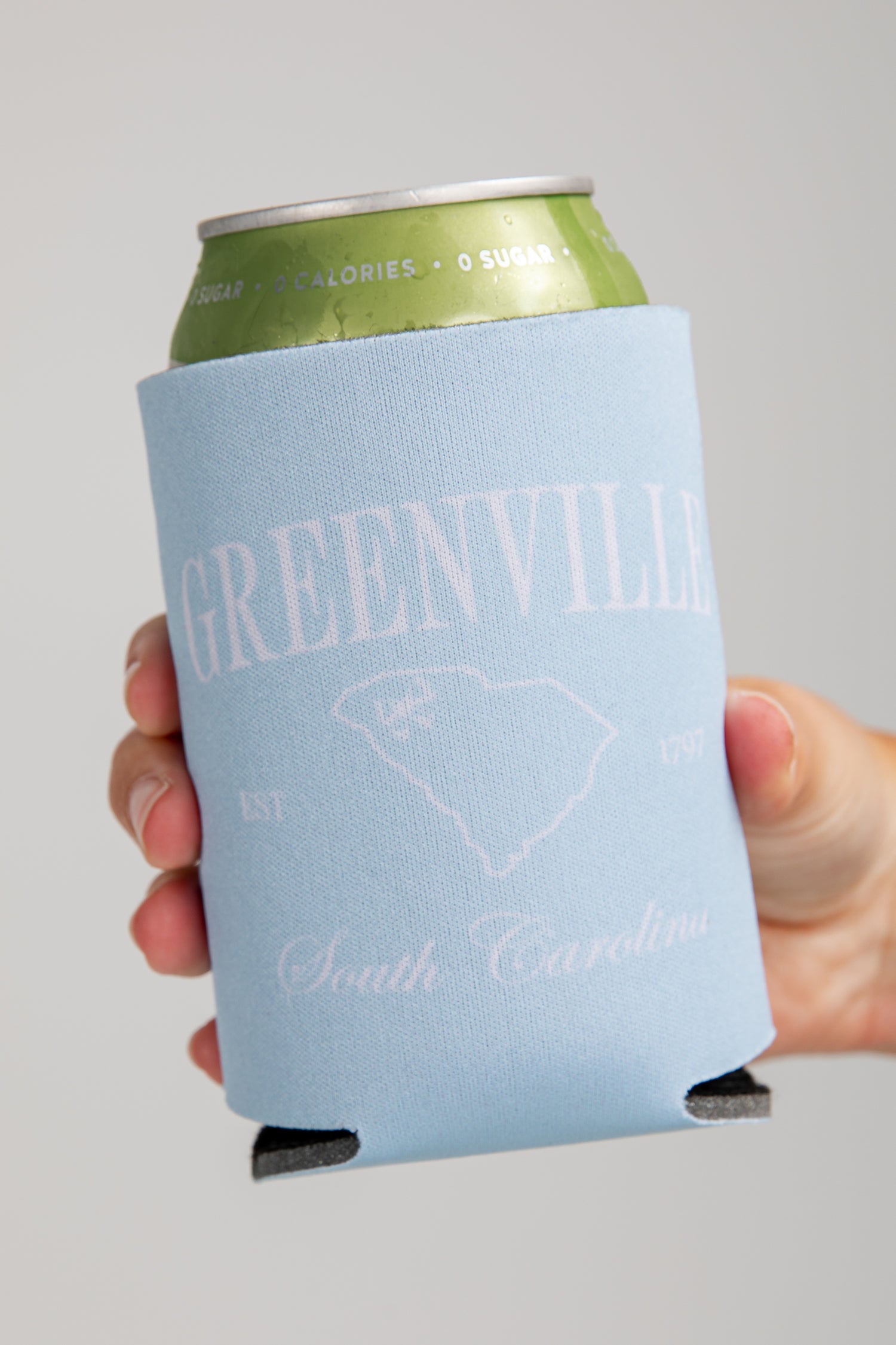 Can with a blue sleeve labeled &