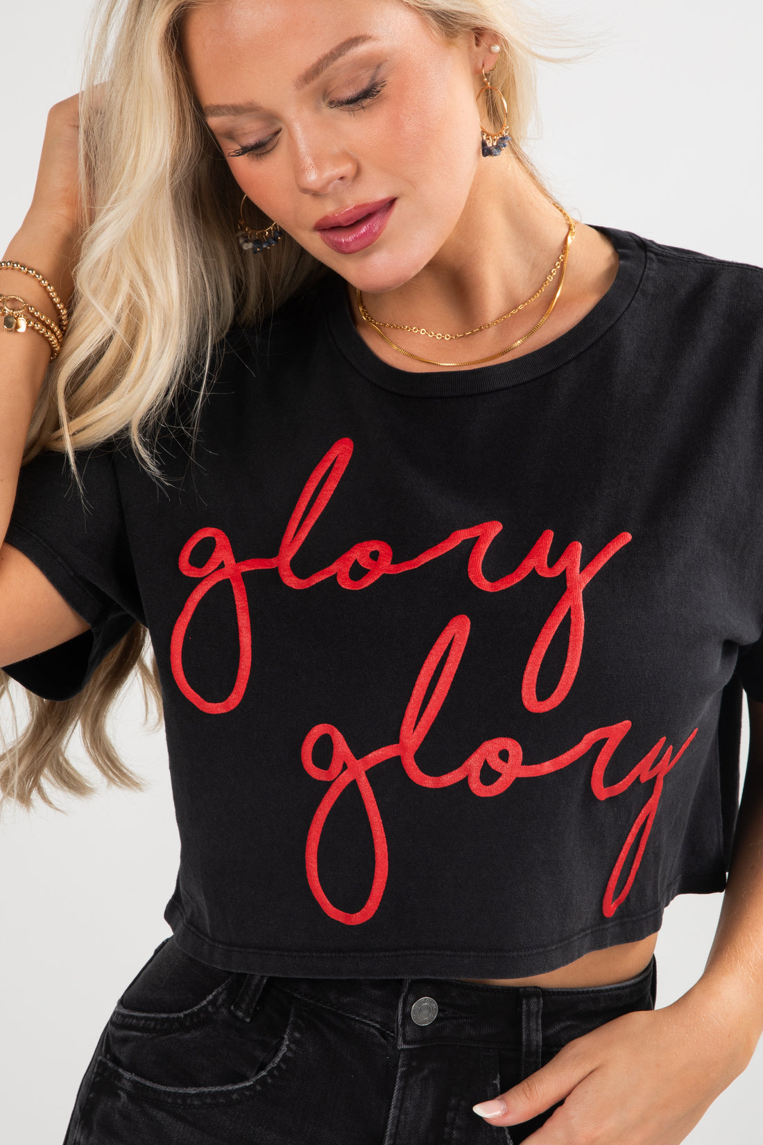 Person wearing a black t-shirt with &