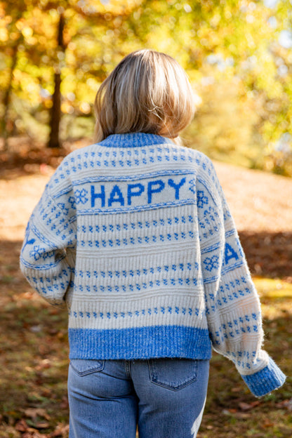 Person wearing a sweater with &