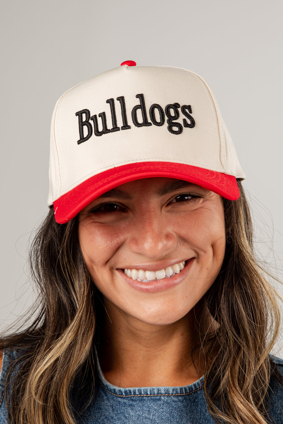 Person wearing a cap with &