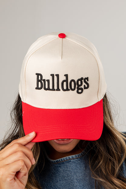 Person wearing a cap with &