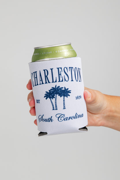 Hand holding a can cooler with &