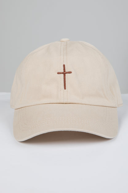 Beige cap with a brown cross on a white background
