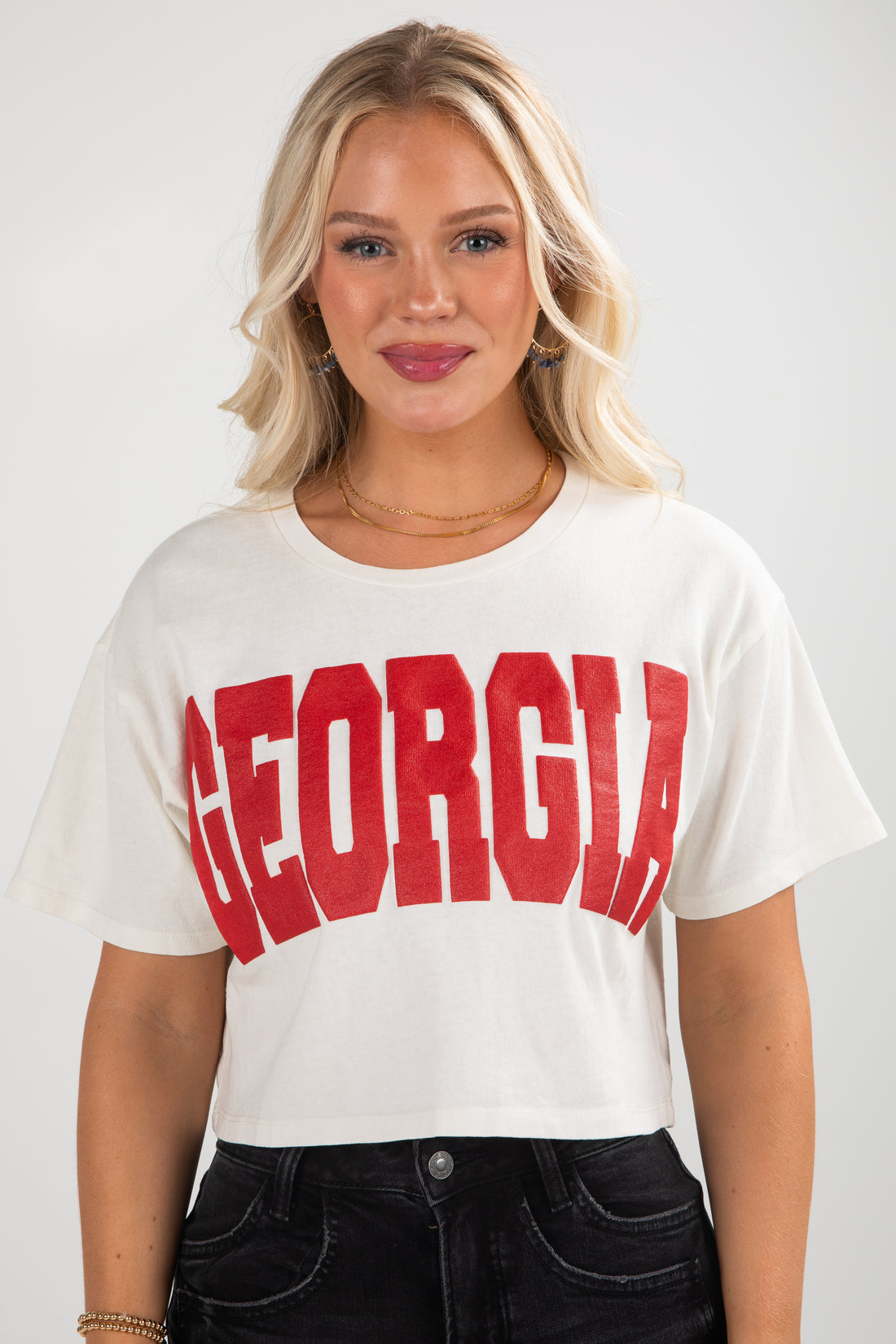 Woman wearing a white t-shirt with &