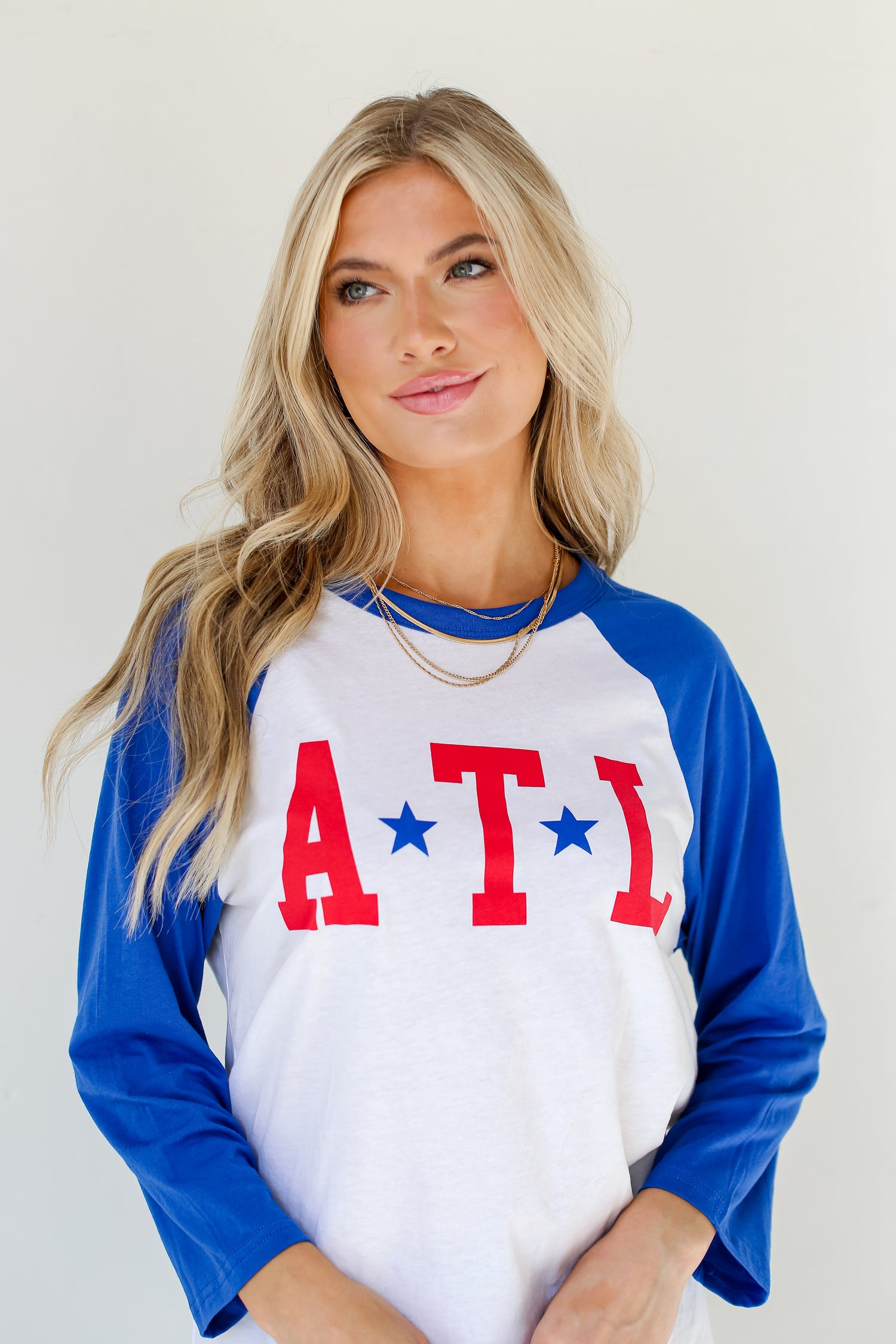 dress up model wearing an ATL Star Raglan Tee