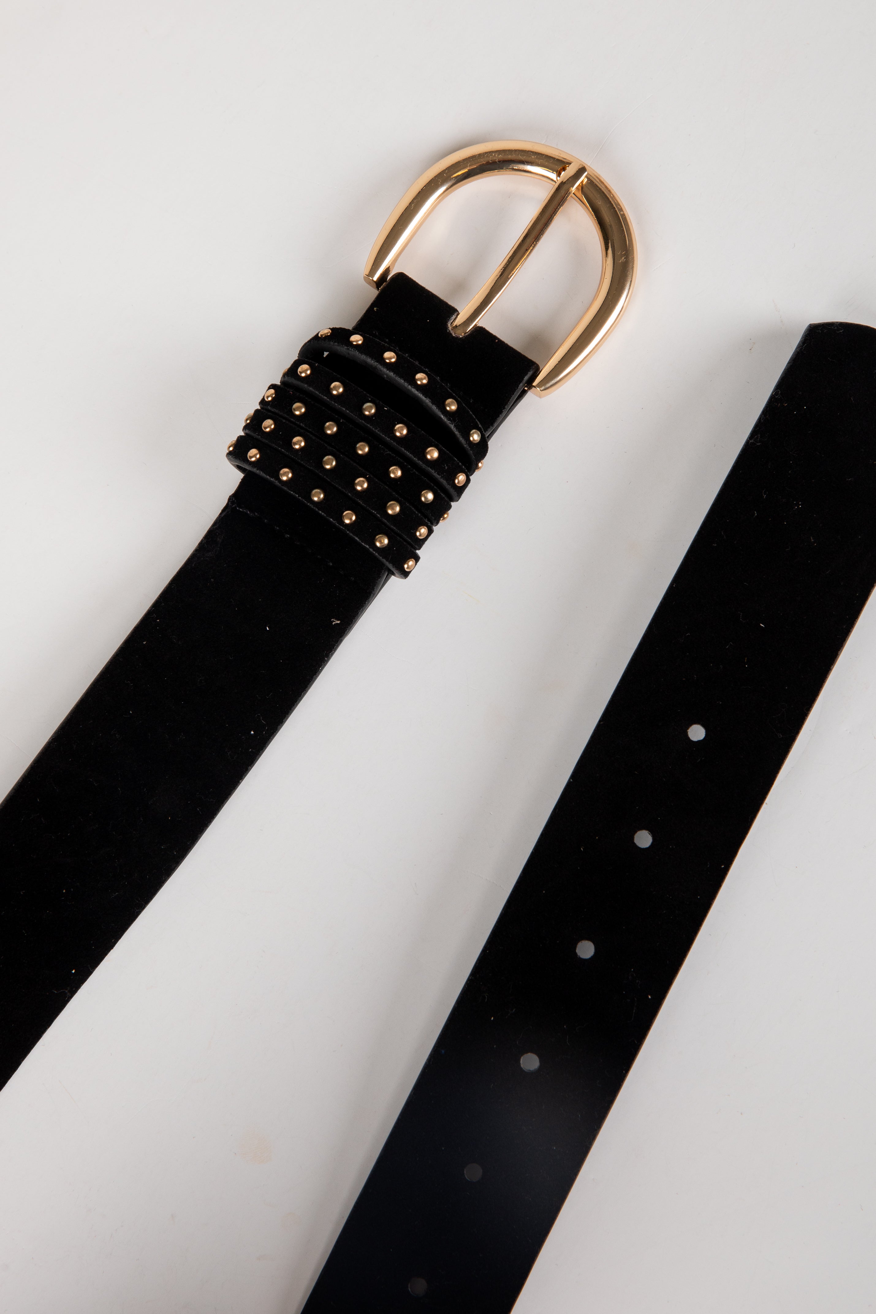 Black belt with gold buckle on a white background