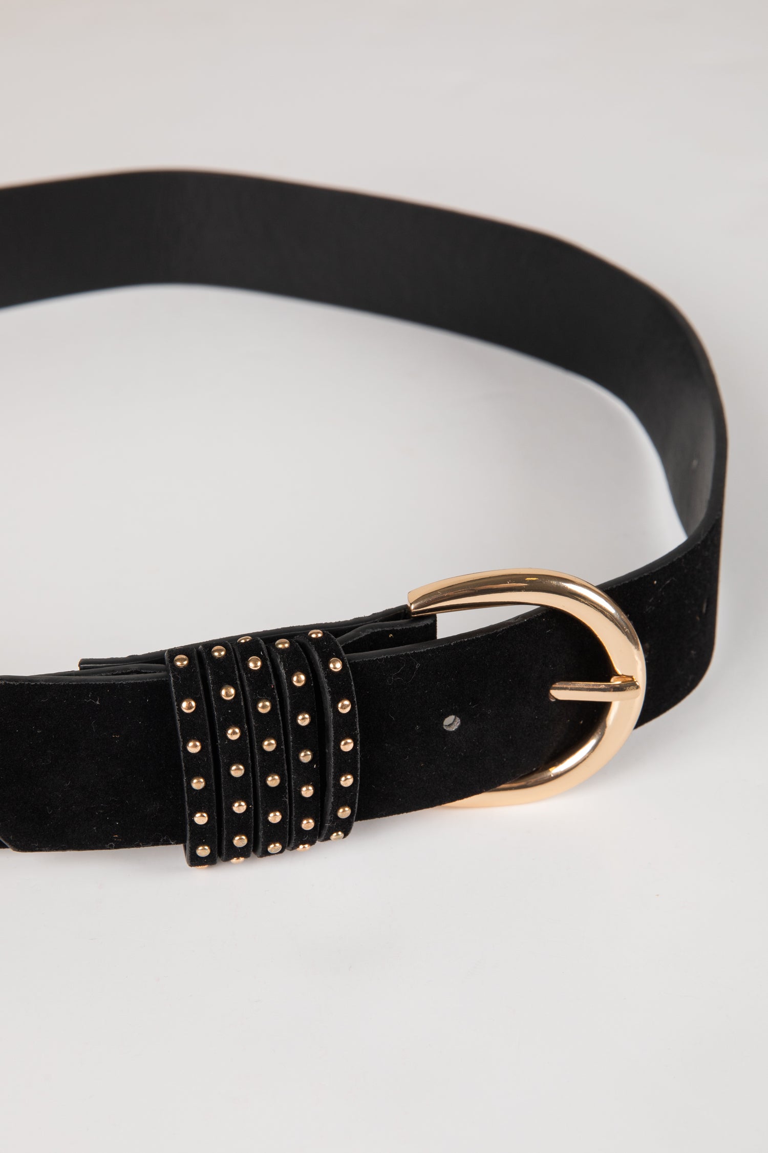 Black belt with gold studded detail and buckle on a white background