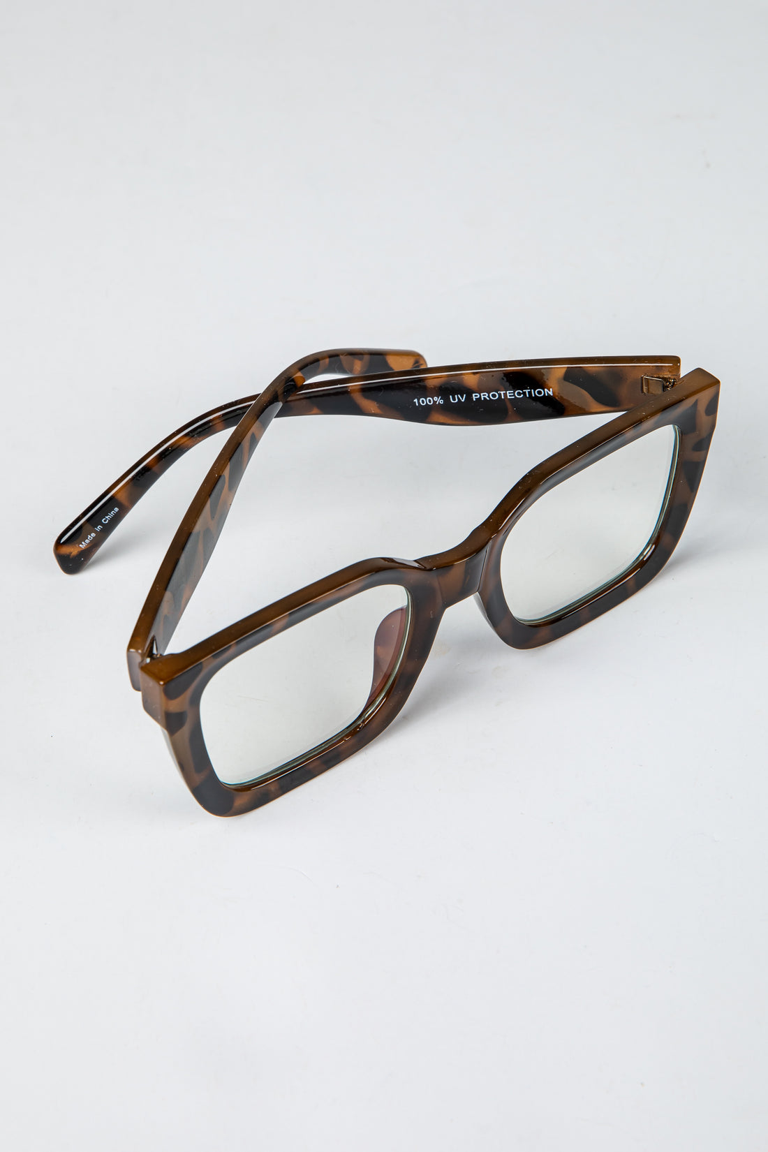 Brown tortoiseshell glasses on a white background