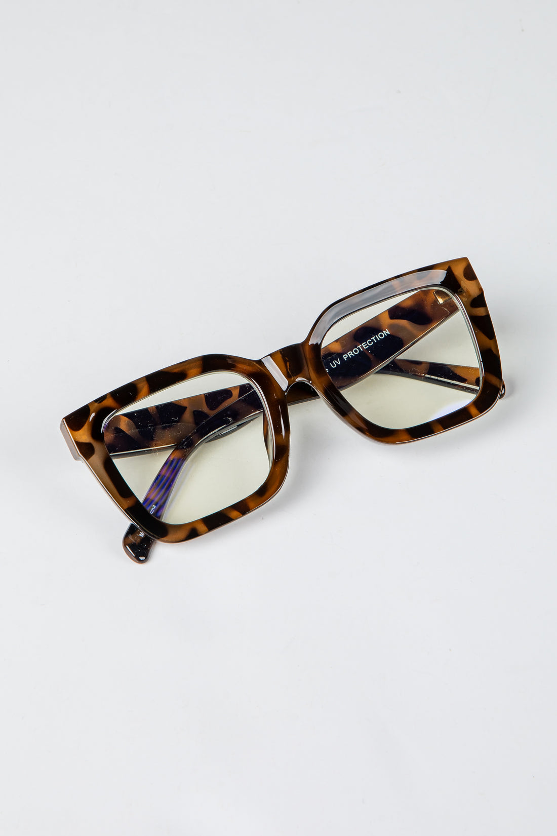 Tortoiseshell cat-eye glasses on a white background