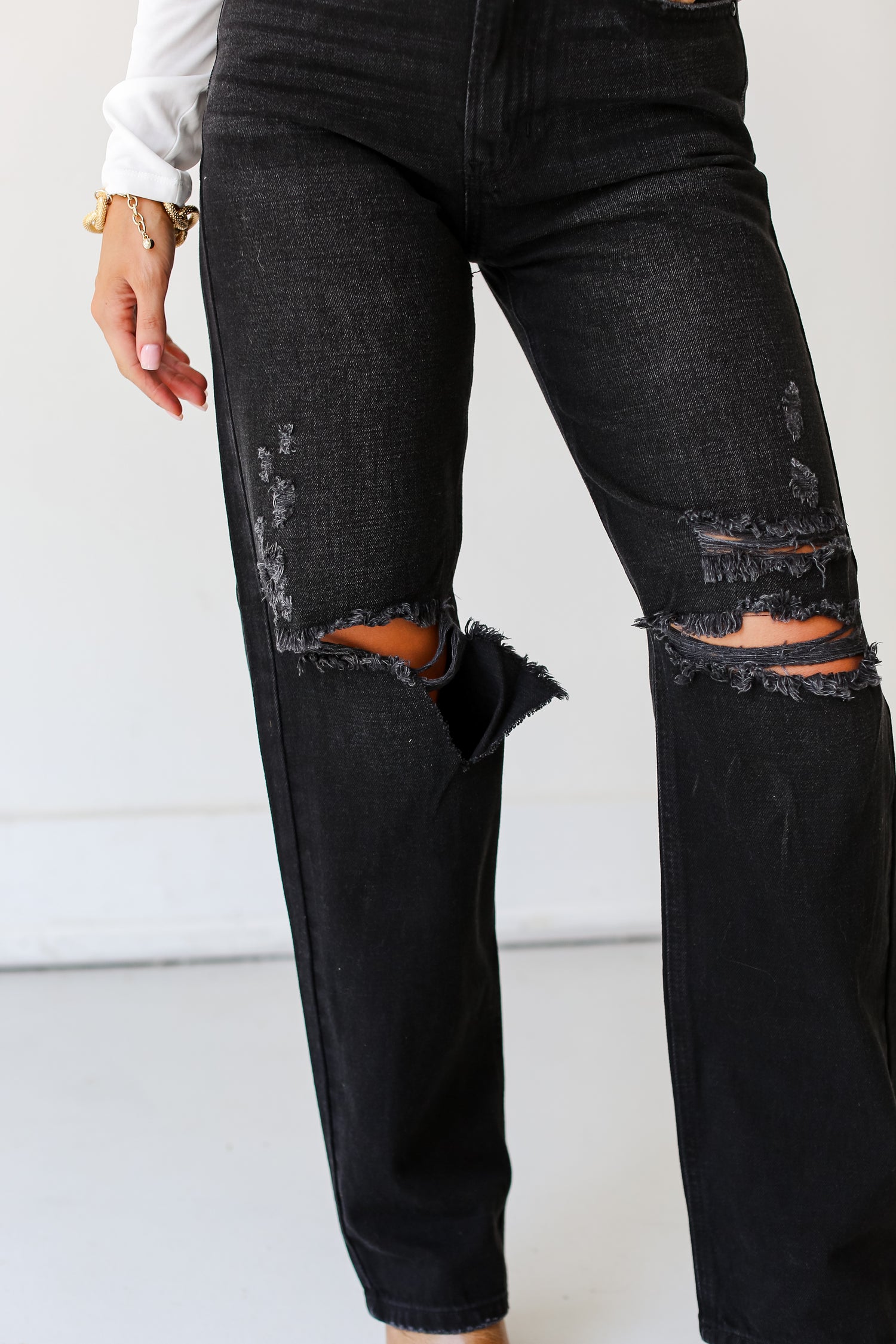 model wearing Black Distressed Dad Jeans