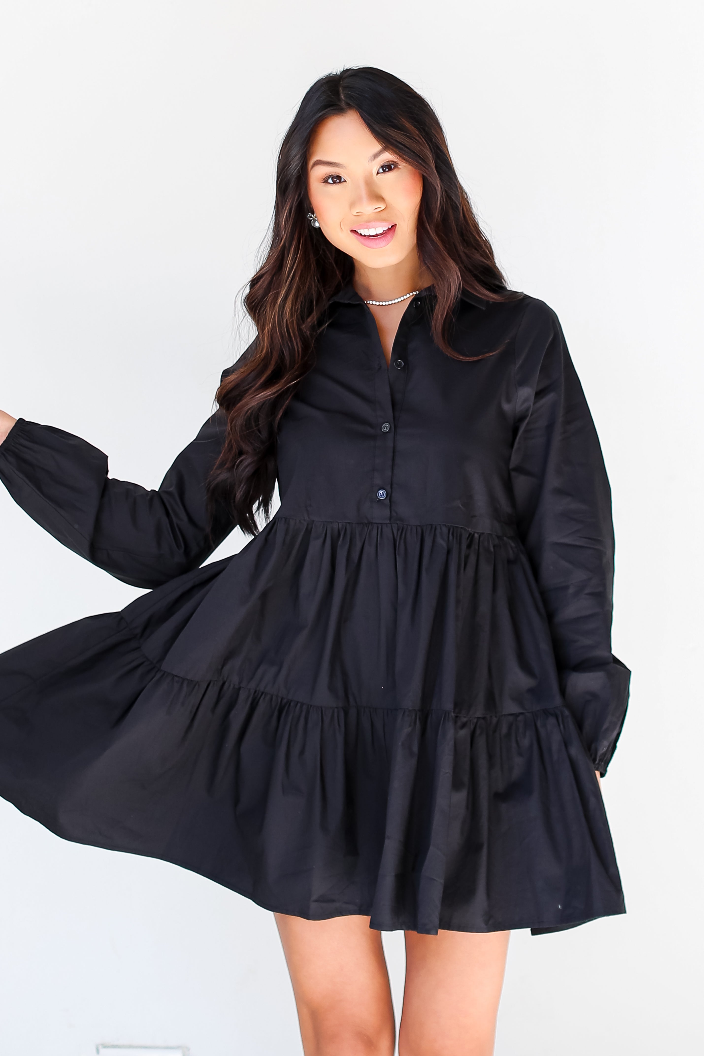 model wearing a black Tiered Mini Dress