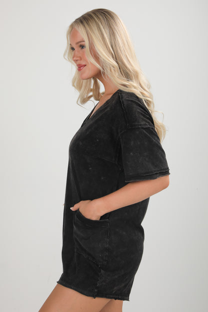 Woman wearing a black oversized t-shirt on a white background