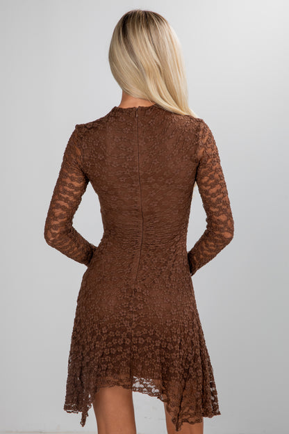 Brown lace dress worn by a person on a plain background
