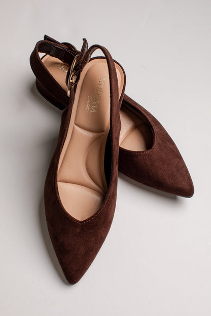 A pair of dark brown suede pointed-toe slingback pumps with a low block heel, displayed on a light gray background.