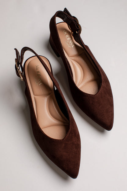 A pair of dark brown suede slingback pumps with pointed toes and low block heels, displayed on a light gray background.