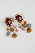 Pair of earrings with multicolored gemstones on a white background