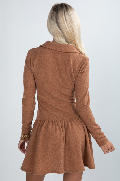 Brown dress worn by a person on a white background