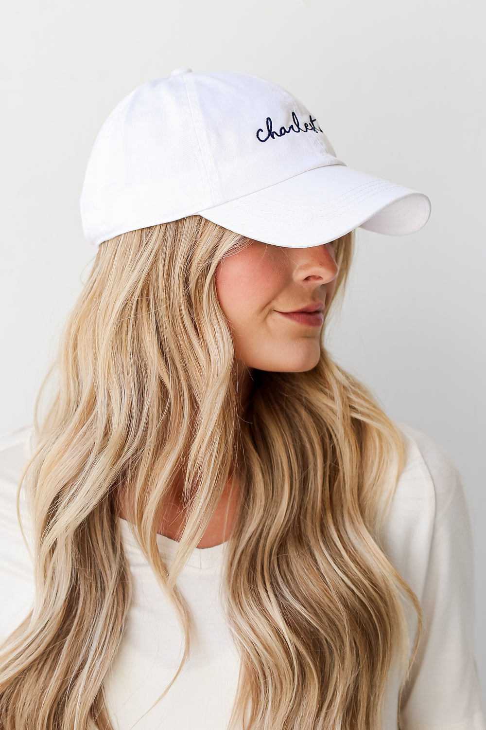 White Charleston Script Embroidered Hat on model