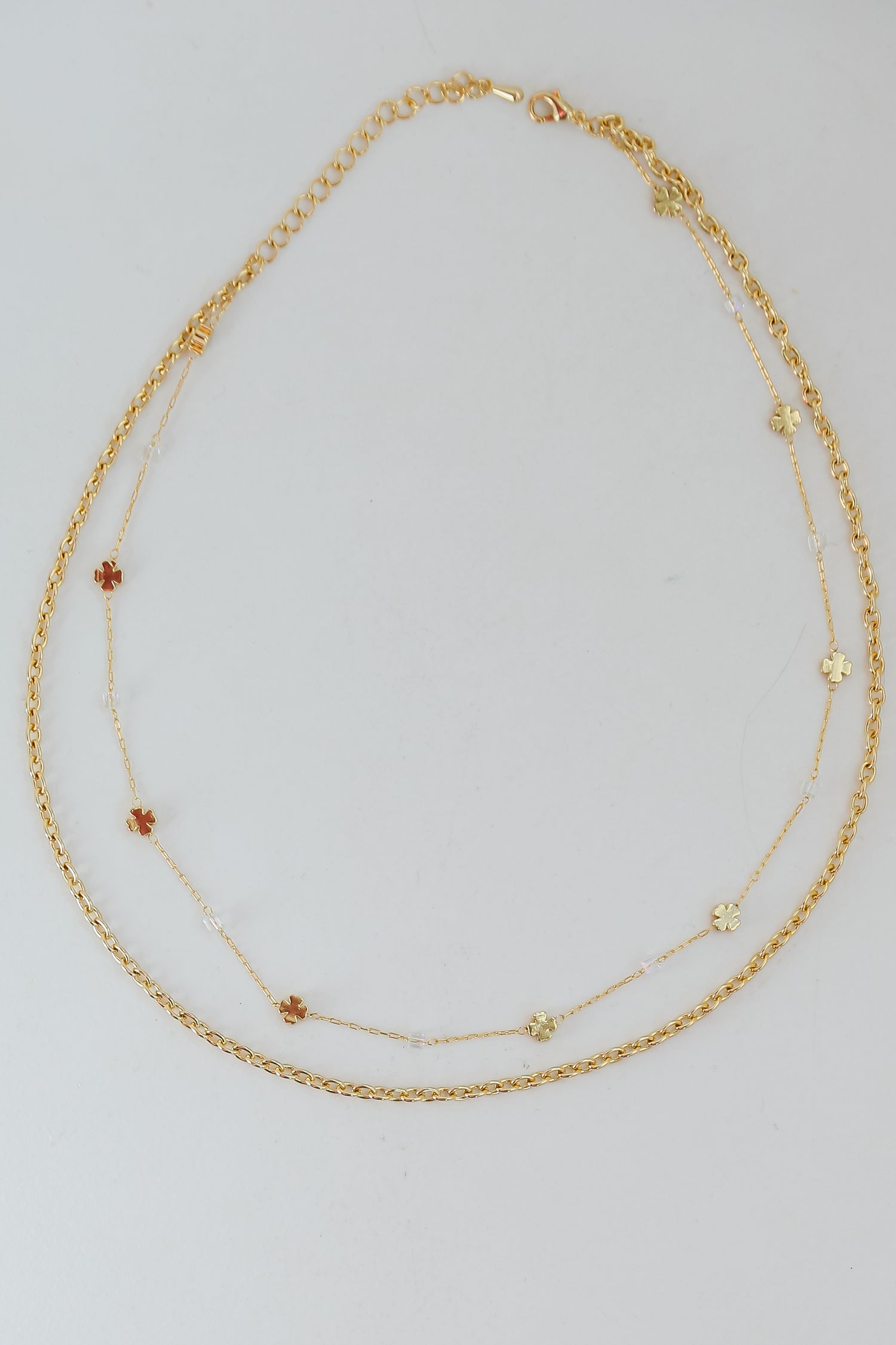 Gold Four Leaf Clover Layered Chain Necklace flat lay