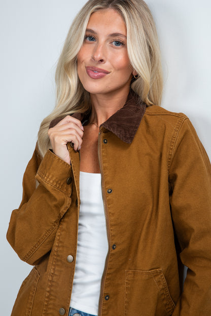 Woman wearing a brown jacket with a white background