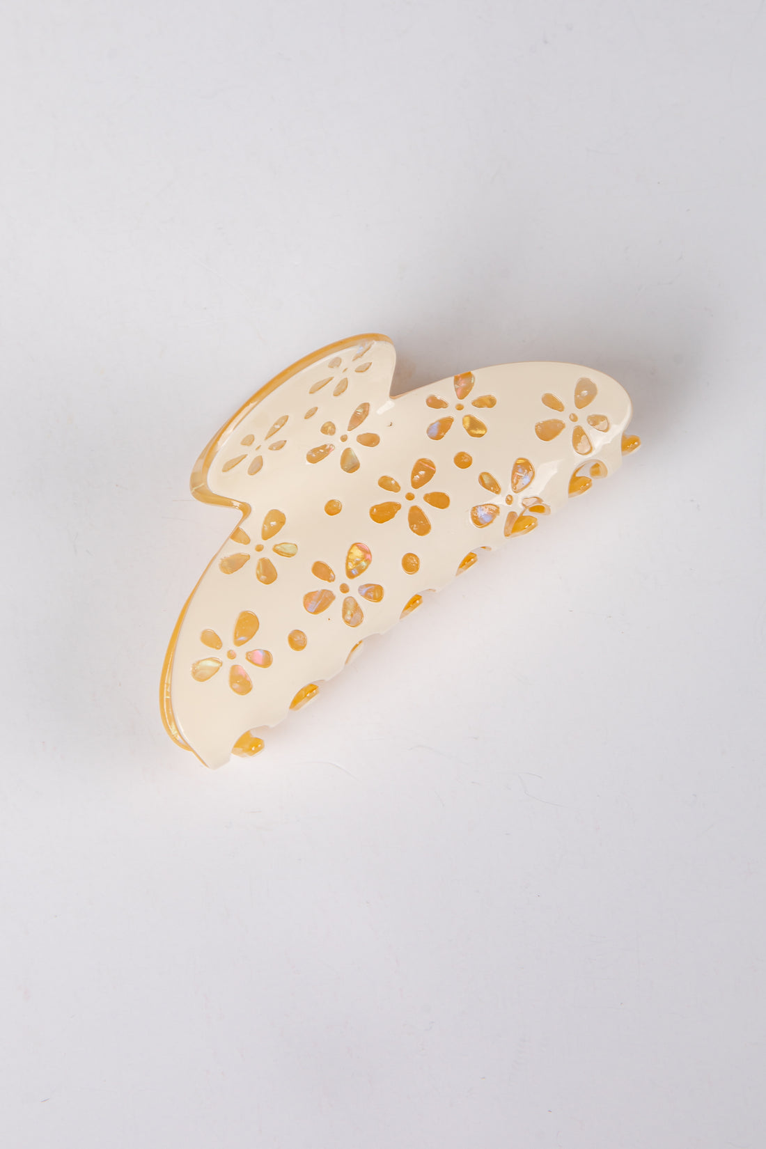 hair clip with floral patterns on a light gray background